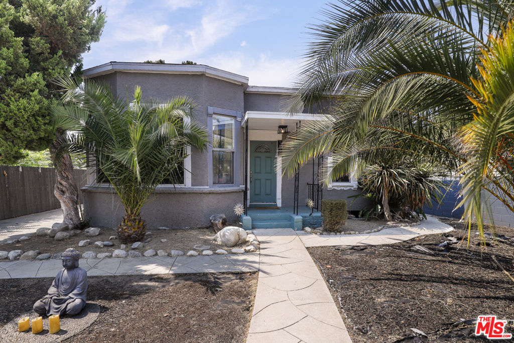 Stylish Highland Park Retreat with Designer Touches and Income Potential! Step into this beautifully updated 3-bed, 2-bath home in the heart of Highland Park. With approx. 1,622 sq ft of living space on a spacious 7,502 sq ft lot, this home blends original charm with modern upgrades. The light-filled interior features an open floor plan, engineered wood flooring, a sleek kitchen with quartz counters, and stainless steel appliances. The primary suite includes a custom walk-in closet and an en-suite bath with dual vanities. French doors lead to an oversized backyard perfect for entertaining, gardening, or adding an ADU (buyer to verify). A detached garage offers storage, parking, or potential studio space. Located on a quiet street just moments from York Blvd, Highland Park Bowl, Cafe de Leche, and Gold Line Metro access. Easy commute to DTLA, Eagle Rock, and Pasadena. Enjoy the Eastside lifestyle in a move-in-ready home with character, outdoor space, and future upside.