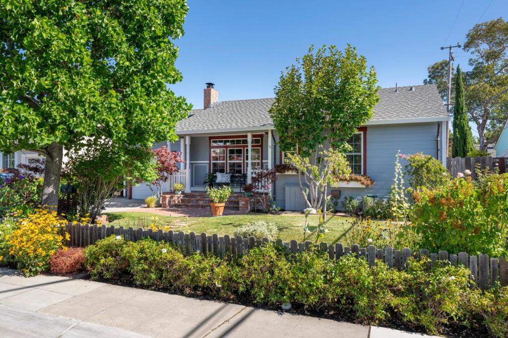 Storybook charm at its finest! This picture-perfect front yard greets you with vibrant blooms, picket fence, custom copper-lined planter boxes that cradle color in every sill and a winding stone path leading to a brick porch made for everyday moments. DETAILS TO LOVE: original 1940 hardwood floors, vinyl windows, wood-burning fireplace w/custom mantel outfitted with discreet outlets, built-in mahogany bookshelf/cabinets, custom wainscoting walls, soffit ceilings, updated kitchen w/Carrera marble countertops and breakfast nook, laundry/mud room w/half bath, updated bath with B/W tile/marble and textured glass door for vintage charm. Copper plumbing throughout. New composition roof, interior/exterior doors, sheetrock throughout w/R19 insulation and more! A clear redwood deck anchors the tranquil backyard, blending timeless beauty with custom pergola dressed in Wisteria vines, mature plants/trees, brick patio, copper sink, playhouse/shed with electricity/windows, garden and wood sheds, 3-tier water fountain with its own playlist, Sun awnings, hose bibs all around, finished 1-car garage w/epoxy floors, built-in cabinets with pegboard fronts and a dedicated workbench - your organizational masterpiece. Central location near downtown, parks, shopping, and just 10 minutes to SFO.