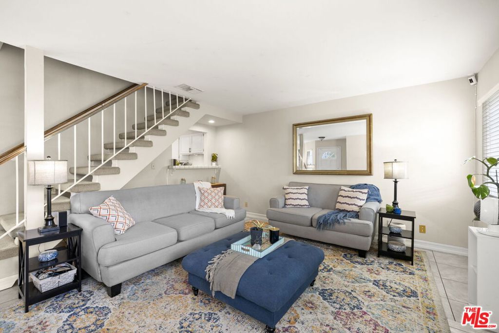 Located at the end of a private, gated community, this three-bedroom, two-and-a-half-bath townhome offers the feel of a single-family home. Sharing only one wall, it features a private two-car attached garage and a wraparound yard that's perfect for entertaining or relaxing. Inside, the spacious living room is filled with natural light and is anchored by a cozy fireplace. A dedicated dining area enjoys views of the yard, while the well-designed floor plan provides three generously sized bedrooms, each with direct access to a bathroom. One bedroom boasts a walk-in closet, and there is ample storage throughout the home. With low HOA dues and access to a gated pool and jacuzzi, this beautifully maintained home is a wonderful opportunity.