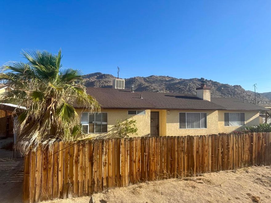Desert Oasis on Over 1 Acre - Very close to Joshua Tree. Room to grow!!Incredible location with panoramic desert views! This meticulously maintained, one-owner home is situated on just over 1 acre, ideally located between Joshua Tree and 29 Palms. Built in 1986, this newer construction features a 2-car attached garage, covered RV parking, multiple storage sheds, and a fully fenced yard.Enjoy privacy, space, and functionality with city water, electric, septic, and propane already in place. Bonus 15x15 detached structure is ready to be transformed--perfect for a studio, workshop, or guest space.Move-in ready with tons of potential to add value and make it your own. Peaceful setting with the convenience of being close to everything--shops, schools, and Joshua Tree National Park--while feeling worlds away in your own private retreat.Don't miss this rare opportunity to own a well-kept home in a prime high-desert location. Call today for a private showing!