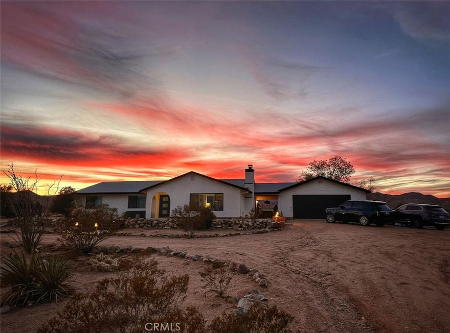 Exquisitely Renovated 3 Bedroom 2 Bathroom Home on 5 Acres with Mountain Views and Pool

Welcome to your High Desert haven! This beautifully remodeled 3-bedroom, 2-bath retreat, that also features a bonus, and private, casita, that sets on a 5 fully fenced acres of pristine native landscape, offers stunning views of Goat Mountain and the surrounding desert. Enjoy unmatched peace and privacy just minutes from La Copine, Pioneertown, and the Integratron.

As you step inside, you are greeted by an open floor plan filled with natural light, creating an airy atmosphere that flows seamlessly throughout the home. The modern concrete flooring and custom double door entry lead you into a stylish living room featuring a cozy masonry fireplace and custom light fixtures, perfect for relaxation or entertaining.

The large gourmet kitchen is a chef's dream, showcasing butcher block countertops, pendant lighting, stunning modern cabinetry, and a galley sink equipped with all appliances. Designed with entertaining in mind, this kitchen opens up to the living area, allowing you to prepare your favorite meals while staying engaged with your guests.

The renovated guest bathroom is a true standout, featuring beautiful retro tile, a walk-in shower with a stylish backsplash, a concrete vanity with a square molded sink, and custom mirrors. Each spacious guest bedroom offers breathtaking views, ceiling fans for comfort, tasteful mirrors, and individual mini-splits for efficient heating and cooling.

The primary suite is a tranquil retreat, flooded with natural light from dual-pane windows. It includes a private bathroom with a large walk-in retro tile shower, a block wood vanity, an upgraded sink, and a chic mirror.

A bonus Casita adds even more versatility to the property, boasting stunning open beam ceilings and concrete flooring, making it an ideal space for a yoga studio, music studio, art studio, home office, or whatever your imagination desires.

Step outside to discover your own private oasis. A privacy fence wraps around the gorgeous modern pool, complete with a remote control covering system. This backyard area is perfect for hosting barbecues, gatherings, or simply enjoying a refreshing dip under the stars.

With so many features to explore, this property truly needs to be seen to be appreciated. Call today for your private showing and experience modern desert living—effortlessly stylish, endlessly peaceful, and full of potential—before it’s gone!