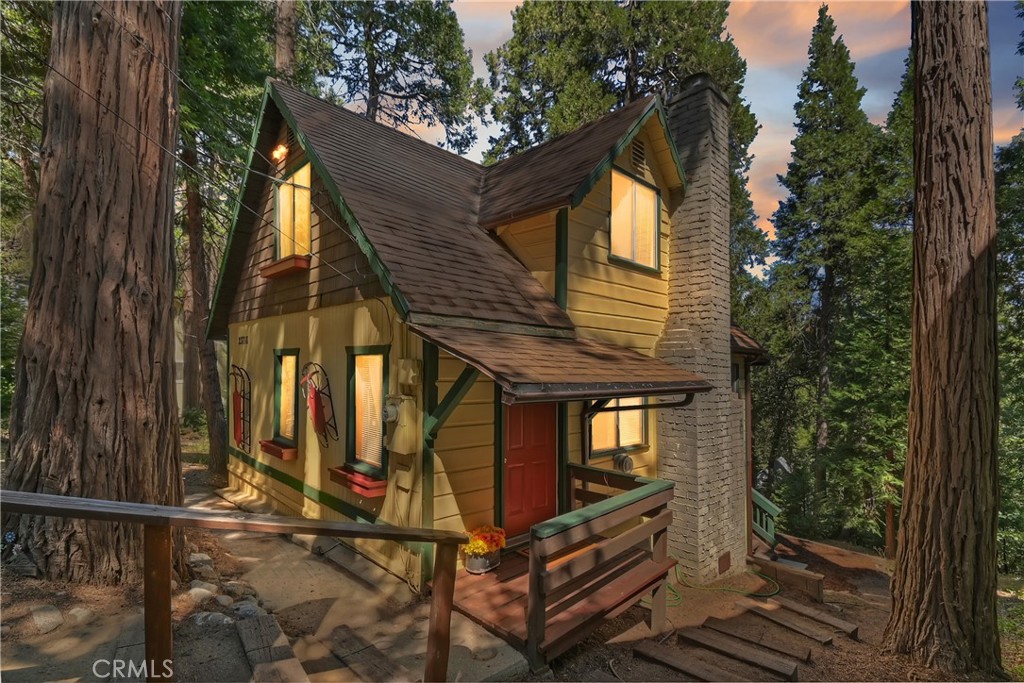 Discover this vintage mountain charmer—a cozy one-bedroom, one-bath cottage with original hardwood flooring, as well as cedar walls and ceilings, that bring warmth and character throughout. Plenty of large windows in the living room and dining area allow you to enjoy the inviting outside views. Upstairs is a large 1 bedroom space. Perfect as a mountain getaway or full-time retreat, this home offers the charm of yesteryear with the convenience of a great location. Just minutes from downtown Crestline, Lake Gregory, shopping, dining, and the beautiful Lake Gregory Regional Park, you’ll enjoy easy access to all the area has to offer. This vintage cabin sits on a generous, gently sloping wooded lot. Whether you’re seeking a weekend escape or a quaint year-round residence, this cottage is the mountain retreat you’ve been looking for!