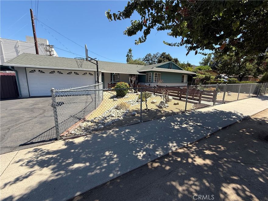 Welcome to this charming 3-bedroom, 2-bathroom home in the heart of Sunland. Fully fenced for added privacy and security, this property offers a perfect balance of comfort and functionality. A spacious driveway leads to the attached 2-car garage, providing plenty of parking. The front yard features a low-maintenance desert-style landscape with beautiful plants that enhance its curb appeal.



Inside, the home boasts a recently remodeled kitchen and dining area, complete with updated countertops, cabinets, and tile flooring. The rest of the home is finished with sleek laminate floors, while the bathrooms feature durable tile. The bright and inviting living room is filled with natural light from large windows and includes direct access to the backyard.



Step outside to enjoy a private oasis—an expansive backyard with a sparkling pool and plenty of open space, ideal for relaxing or entertaining. There is also a bonus bathroom! 



Additional upgrades include a brand-new HVAC system, replaced just six months ago, ensuring year-round comfort.



This Sunland gem combines modern updates, outdoor enjoyment, and everyday convenience—ready for you to call home!
