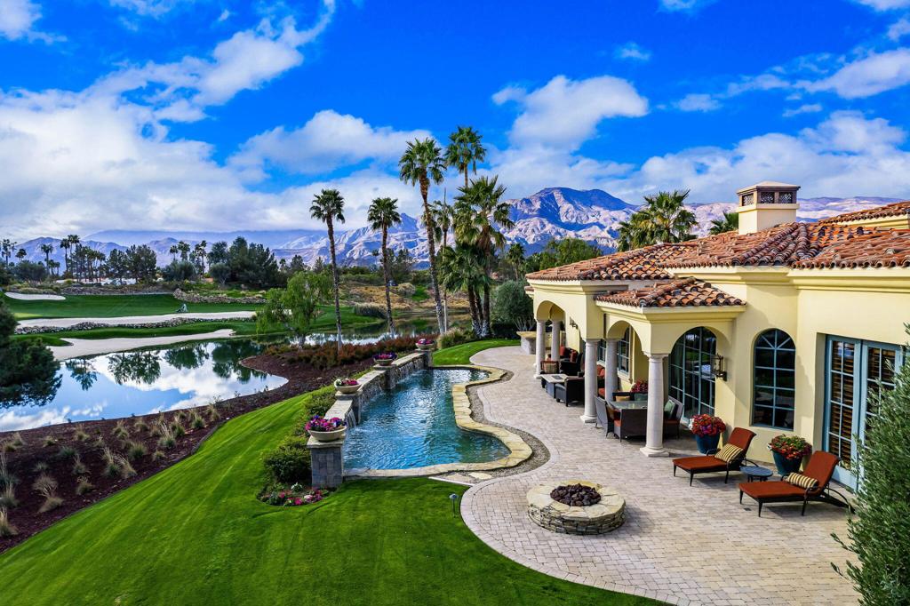 Incredible custom home located behind the private gates of The Hideaway! This 6388 square foot home sits on a cul-de-sac and offers great space for family & friends! Courtyard entry takes you to one of two pools on the property with direct access to the guesthouse with sitting room, kitchenette, walk in closet, bedroom, and bath. These is also a courtyard staircase that leads to the second casita with large bedroom and private bath and balcony! Step into the iron and glass double doors that lead to the formal entry and living area with fireplace, travertine flooring, with a backdrop of large windows. Large culinary kitchen with warm wood cabinetry, granite slab counters, 2 islands both with sinks, stainless appliances. The dining area and family room is just off the kitchen with fireplace, wet bar and walk in wine vault to make for great entertaining! Large primary suite with hardwood flooring, sitting area with fireplace, stunning custom walk in closet, beautifully appointed primary bath with soaking tub, walk in shower, & double vanities. There is a private office with warm finishing including wood flooring, custom wood built-ins, and shutters. There is additional space in the main house that is being used as a media room. The second pool is located in the back with paver patio, flowing water features, built in BBQ island, fire pit, and plenty of room for dining or lounging in the sun! Take in the stunning panoramic views of the fairway, lake, and mountains this home has to offer! There is a long paver driveway leading to the 2 car garage with an additional golf cart garage!*NOTE: Home is set up as a 3 bedroom, office, and media room/study but can be a 5 bedroom home as each room has its own bathroom, closet,& doors that open up to the outside.