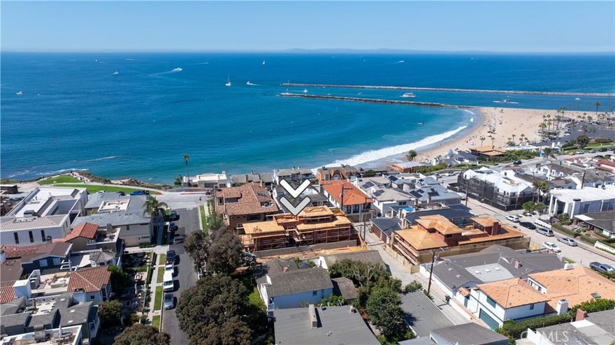 Step into coastal elegance at 209 Narcissus, a new construction opportunity in Corona del Mar’s coveted Flower Streets, designed by EBTA Architects and developed by PXG Development. Currently in framing with anticipated completion in summer 2026, this three-level residence offers a rare chance to purchase now and participate in the finishing process—allowing the buyer to personalize interior selections and create a truly bespoke coastal retreat. The home spans approximately 2,948 sq ft with four ensuite bedrooms, two 1/2 baths, and an attached two-car garage. Light-filled living spaces transition seamlessly to an elevated front patio and an upper-level deck, both ideal for entertaining with Catalina and ocean views as a backdrop. Thoughtfully designed floorplan with an elevator to all three levels, balances privacy and open gathering areas, blending modern sophistication with timeless coastal architecture. Set south of Pacific Coast Highway, this prime location places you mere steps from Big Corona Beach, celebrated tide pools, and the scenic blufftops of Lookout Point. The vibrant CdM Village is equally close, offering boutique shops, cafes, and acclaimed dining—all within walking distance. The Flower Streets are recognized as one of Southern California’s most desirable neighborhoods, with strong values supported by a mix of charming cottages, custom estates, and new builds that command premium pricing. Purchasing at this stage provides a unique advantage: secure a brand-new home in one of Orange County’s most sought-after enclaves while enjoying the ability to shape finishes to your taste. Rather than compromise on someone else’s vision, you can guide the final design of your kitchen, baths, flooring, and fixtures. Once complete, the home will deliver the effortless indoor-outdoor lifestyle Corona del Mar is renowned for, with daily ocean breezes, golden-hour views, and walkable access to village charm. Don’t miss this chance to create your personalized coastal sanctuary in an irreplaceable location—where architectural distinction, ocean proximity, and community lifestyle converge.