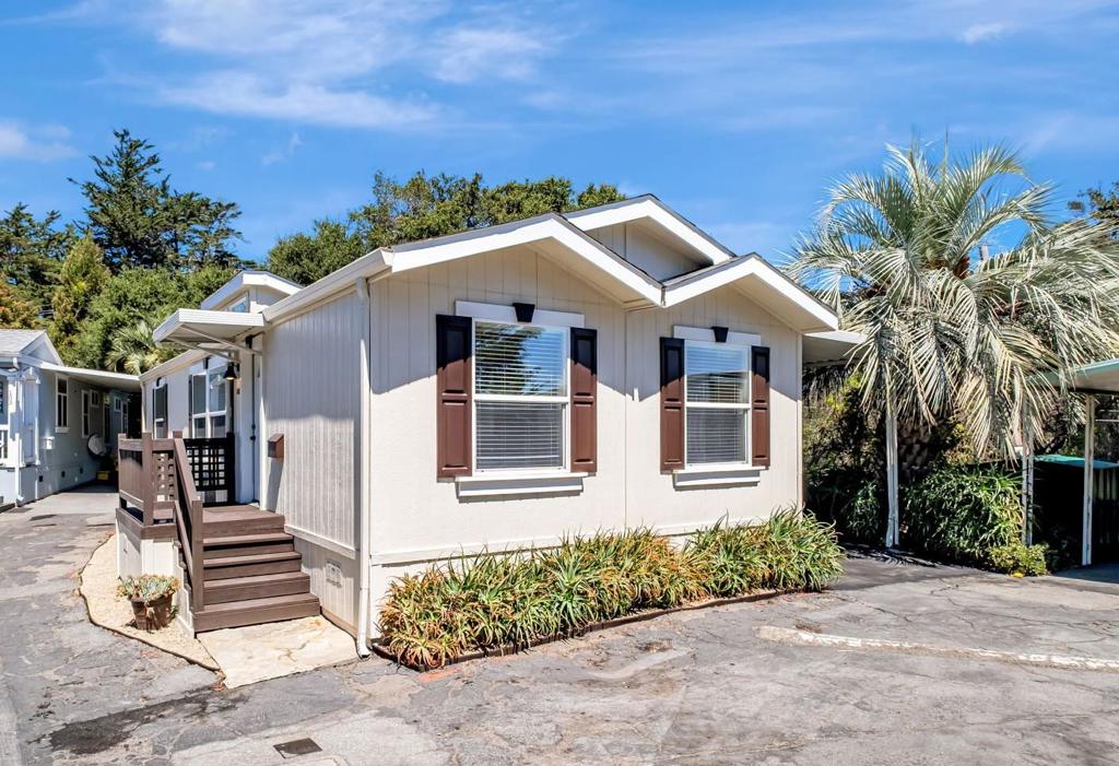 Welcome home. This light and bright, modern 2 bedroom / 2 bath manufactured home is located at the end of a private little cul-de-sac within the sought after Alimur mobile home park. You'll enjoy the many large windows that bathe the interior of this home with abundant natural light. The open layout, with generous countertops and cabinetry in the kitchen and large living area, coupled with high ceilings, only adds to the spacious feel of this charming home. Your large primary bedroom offers a private en suite for comfort and convenience, while the generous guest bedroom provides plenty of space for a desk or cozy work area. This home is conveniently located within walking distance of many restaurants, coffee shops, groceries, banks, parks, schools, and just about everything you will need. It also has an unbeatable location with quick and easy access to Highway 1, 41st Avenue, and all that Capitola has to offer. And once you finish your errands or running around, relax with a book at the sunny community pool or enjoy a game of billiards in the community rec room. Grab this chance at an appealing and affordable Santa Cruz home that's all about convenience and easy living.