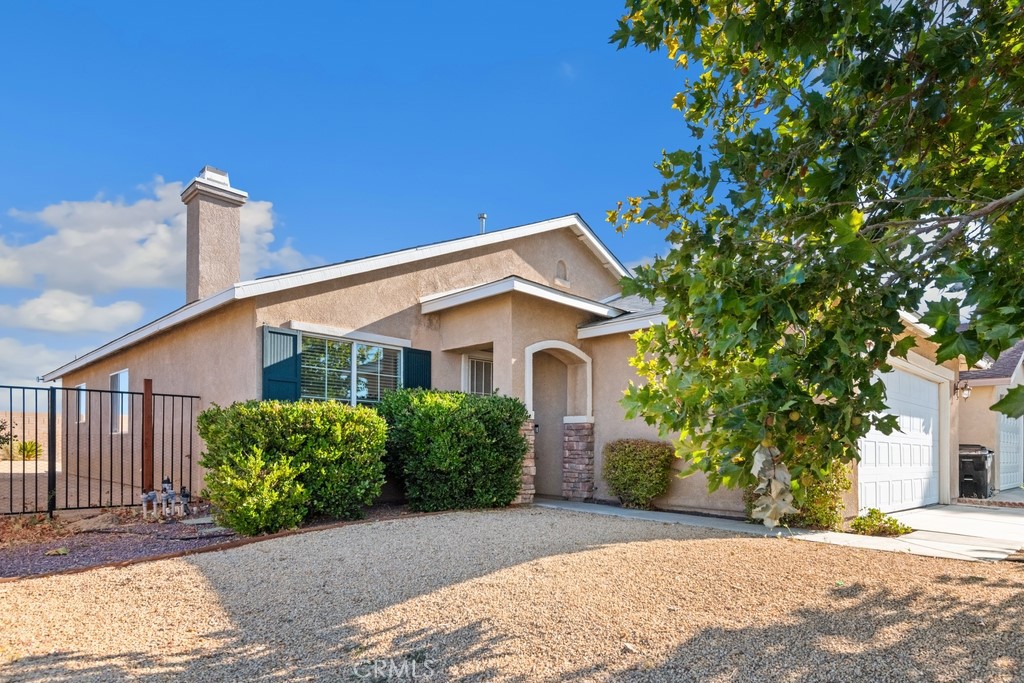 Single level 3 bed, 2 bath home sitting on a corner lot with fantastic curb appeal and low maintenance landscaping is ready to be made yours! The interior features a great floor plan with crisp white walls and tile flooring. The living room offers a fireplace and flows into the formal dining room with chandelier. The large kitchen has wood cabinetry, tile counters, and a second dining area, there is also a slider to the backyard. There are 3 bedrooms with the primary bedroom offering a private, full-size, bathroom and there is a full-size hall bathroom for the 2 secondary bedrooms to share. Enjoy the private backyard with block wall and wood fencing, and concrete area, this space is ready for the new owner's design. There is also an attached 2-car garage. This home is conveniently located near schools, shopping, dining, there are no HOA fees, is located just off of Hwy 395, and it is not far from the 15 Fwy! Schedule your private tour today!