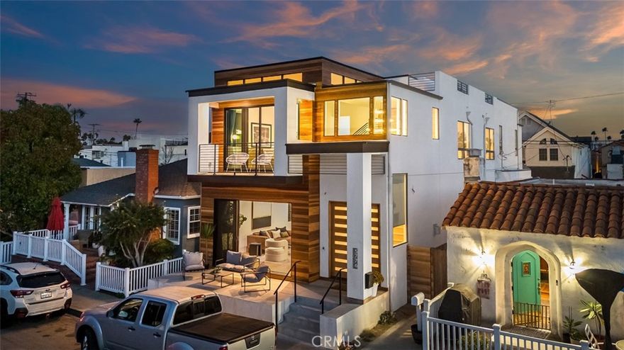 Welcome to 5776 Campo Walk, an architectural stunner on coveted Naples Island, offering the perfect blend of modern design and coastal charm. Rebuilt in 2017, this 4 bedroom, 3 bathroom residence spans 2,758 sq ft and showcases sharp, clean lines with a bright, open floor plan designed for both comfort and entertaining. Step inside and you’ll find two expansive living areas, a sleek, airy layout that flows seamlessly to multiple outdoor spaces. The front deck is ideal for morning coffee, while the 600 sq ft rooftop deck delivers panoramic views, perfect for sunset gatherings or starlit evenings with friends. The oversized primary suite is a true retreat, featuring soaring ceilings, abundant natural light, and a spa-inspired bathroom. Every detail exudes sophistication and function, from the modern finishes to the two car garage providing convenience in this highly walkable neighborhood. Nestled in the heart of Naples Island, this home places you just steps away from everything that makes Long Beach coastal living so special. Enjoy scenic canal walks, paddle boarding, and kayaking, or head over to nearby beaches for a day on the sand. A short stroll takes you to the boutiques, wine bars, and top-tier dining on 2nd Street, where you’ll find everything from fine Italian and fresh seafood to lively bars and local coffee shops. Naples Island also hosts seasonal events such as the Naples Christmas Boat Parade, offering a true sense of community in one of Southern California’s most picturesque waterfront settings. This home is not just a residence, it’s a lifestyle. Modern, elegant, and steps from the water, 5776 Campo Walk is your gateway to the very best of Naples Island living.