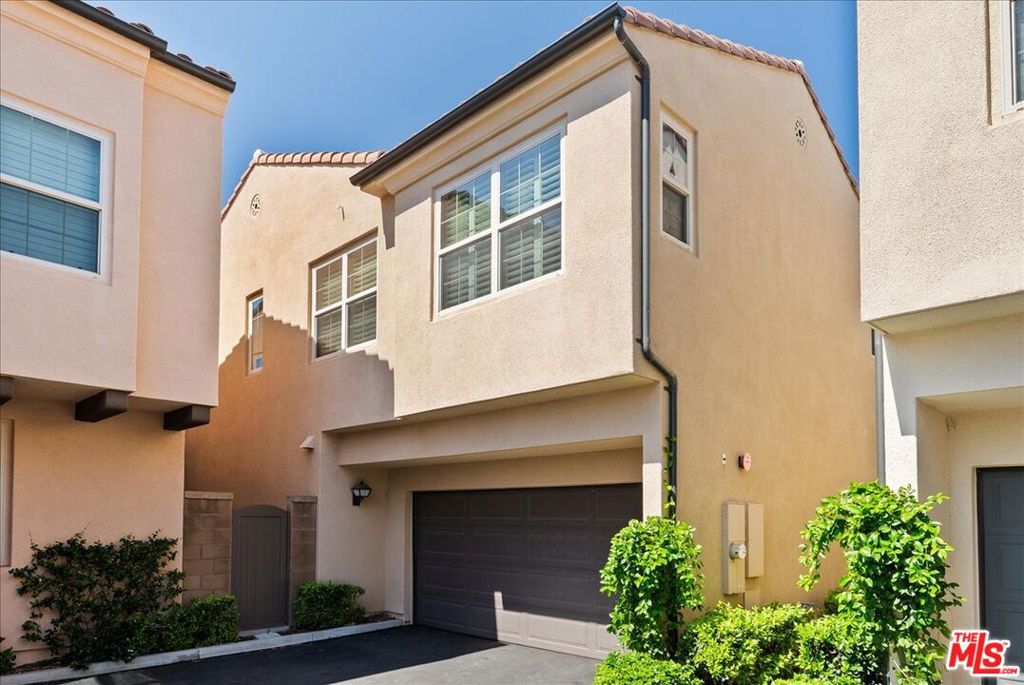 Reminiscent of the Italian countryside and bathed in the ambiance of Portofino, this dreamy DETACHED END UNIT townhome offers unobstructed vistas of Harvest Solution Farm and beyond and is perhaps the best buy in Portola Springs under $1.25mm. Meandering pathways and lush landscaping envelop the romantic front entrance which opens into the luminous open concept great room punctuated by a quartz island kitchen featuring stainless Bertazzoni and Bosch appliances, tasteful glass tile backsplash, a large walk-in pantry, wood floors, and direct access to the private patio garden and 2-car garage. Perfect for a workstation, office, crafting space, or play area, etc, the sizable 2nd floor landing is the heart of the upstairs living quarters, offering 3 generous bedrooms including the phenomenal primary suite highlighted by a spa-like bath complete with dual vanities and walk-in closet, laundry room, and spacious secondary bath. Designer details are exemplified by modern mouldings and hardware, wood floors, numerous dual-pane windows covered with custom plantation shutters, and LED lighting throughout. Within a few blocks of award-winning schools, Woodbury Shopping Center, and close to UCI, Newport Beach, and South Coast Plaza, this remarkable home also enjoys coveted access to community amenities like pristine pools, parks, a clubhouse, a tot playground, basketball, volleyball, and tennis courts, BBQs, and miles of hiking trails. A treat for the discerning buyer who "wants it all."