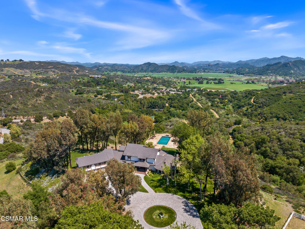 Set in one of Hidden Valley's most breathtaking locations, Treasure Hill Ranch offers a rare opportunity to own a legacy estate with sweeping, unobstructed views. Situated in the historic and pastoral community of Hidden Valley, one of the most exclusive ranch areas in California, this remarkable property captures the essence of privacy, natural beauty, and the unmatched lifestyle that defines the area. Privately gated and graced by stately oak trees and dazzling open space, this equestrian retreat is truly one of a kind, a picturesque, storied property with a charm all its own.Situated on approximately 20 acres of land, the property includes a main residence positioned to take full advantage of the sweeping vistas. A separate guest house offers additional space for family or visitors, and the well-equipped barn features a tack room, offices, and a one-bedroom apartment with a full kitchen, perfect for staff or extended stays. The grounds also showcase an expansive pool and yard with built-in BBQ, creating the perfect setting for entertaining or relaxing while soaking in the unparalleled views.This secluded and gated retreat provides the ultimate in privacy and tranquility, with panoramic views of majestic mountains and wide-open skies. It's an incredible opportunity to create your personal lifestyle vision, whether that means organic gardens, chickens, or even living off the grid. The land is a blank canvas with endless possibilities, an inspiring space for those seeking self-sufficiency, creativity, and connection to nature. Nearby trails wind through the awe-inspiring Santa Monica Mountains, inviting adventure and exploration just beyond your doorstep.Treasure Hill Ranch is more than just a property, it's a lifestyle. Whether you envision a working ranch, a luxurious country getaway, or a family compound, this estate is the perfect canvas for your dream. Ideally situated near Sherwood Country Club and Camarillo Airport, and just 45 minutes from Beverly Hills, this property offers an unrivaled lifestyle in one of Southern California's most desirable and elite communities, ''where the fortunate few come to live amongst legacy, beauty, and a way of life that is truly extraordinary.