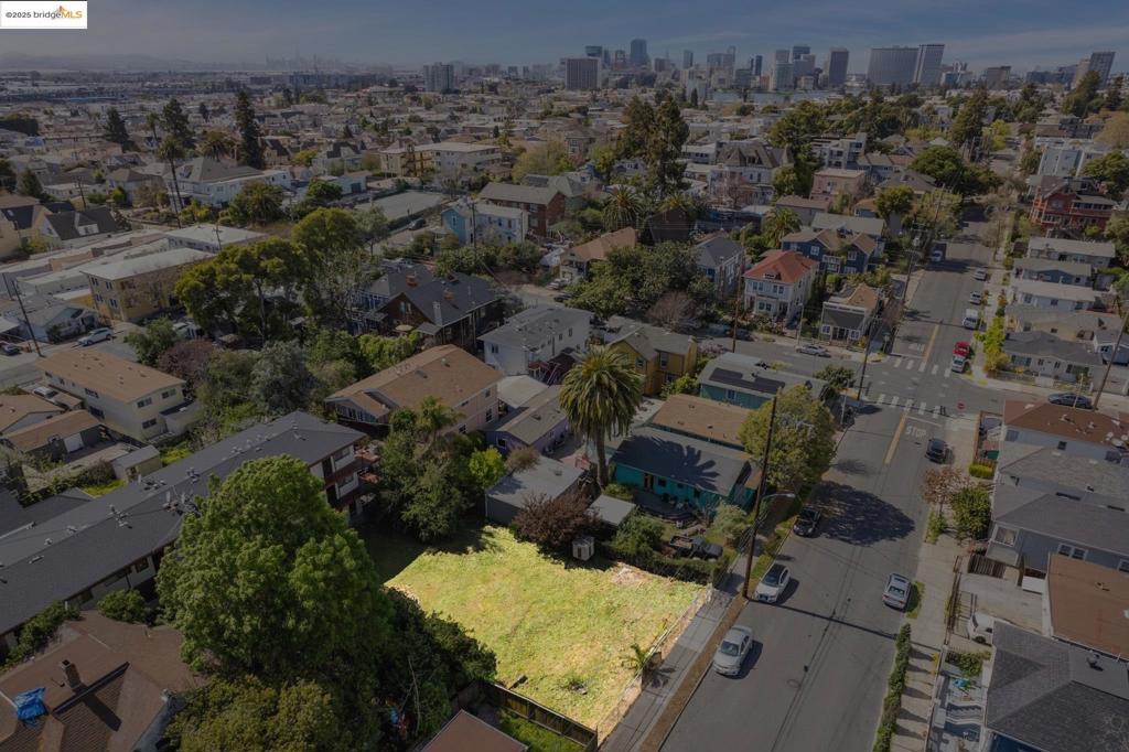 To access marketing package copy/paste: https://bit.ly/kitehillre Take advantage of this exceptional opportunity to own a 6,000 SQFT vacant lot in the desirable Clinton neighborhood of Oakland. Situated on a peaceful street, this property offers the perfect balance of tranquility and convenience. Surrounded by a mix of single-family homes and multifamily residences, this lot is primed for future development, making it an ideal investment for builders, developers, or anyone looking to create their dream property in a thriving community. The included feasibility study confirms the potential to build a stunning multi-unit development, with plans for four spacious units—each featuring 3 bedrooms and 2 bathrooms. This makes the lot a perfect option for a residential project, offering ample space for modern living while maintaining a harmonious presence within the established neighborhood. Whether you're looking to design a brand-new residential complex or maximize the potential of the land, this opportunity is ready for you to make your mark. Conveniently located just 10 blocks from the iconic Lake Merritt, this property is within easy reach of the best that Oakland has to offer. With access to public transportation, dining, shopping, and recreational areas.