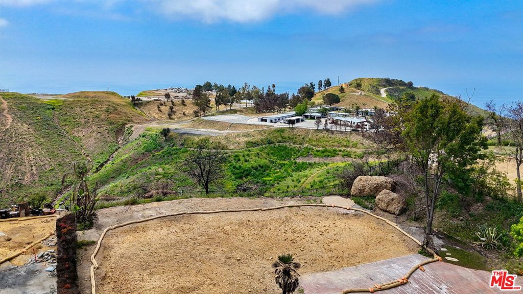 Beautiful ocean views from this Palisades Fire Rebuild opportunity. Previous home was 2,488 sq. ft., two stories, 3 bedrooms, 3 bathrooms with a nice flat front yard looking out to the ocean. Fire rebuild current expediting is allowing an additional 10% of the overall square footage. Amazing opportunity to be at the end of a quiet cul-de-sac and close proximity to Malibu, Calabasas and Santa Monica.