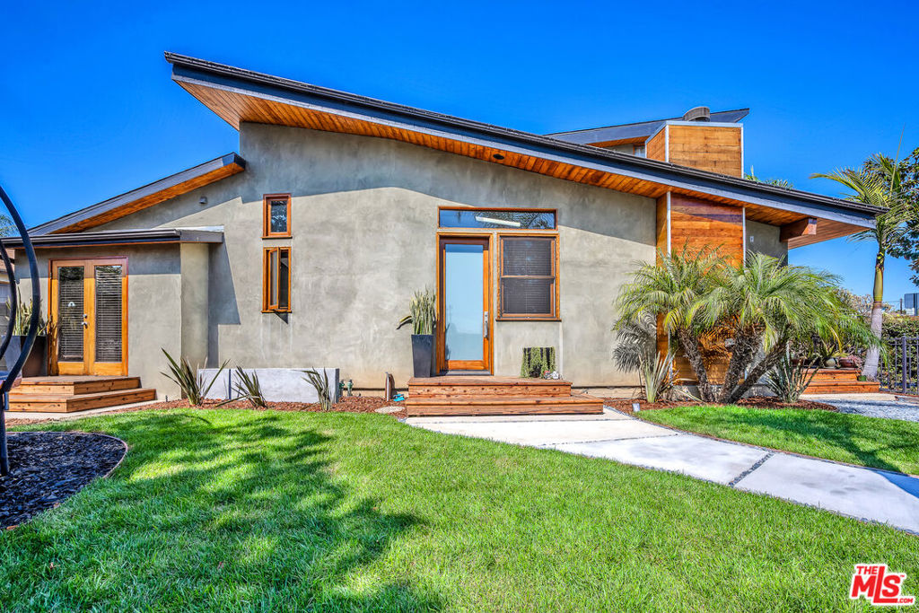 Thoughtfully designed 3-Bed, 3-Bath architectural home comes fully furnished with all Utilities included. Situated on an expansive 8,500 sq ft corner lot in Del Rey this home Boast an open-concept layout with soaring high ceilings and rich hardwood floors through out offering both elegance and comfort. The spacious living and dining areas flow seamlessly into a modern kitchen, ideal for entertaining or relaxing in style. Step outside to your resort-style backyard, featuring a sparkling pool & spa, lush landscaping, and a private, fenced-in yard with mature hedges for added privacy. The outdoor patio area is fully equipped with a built-in BBQ, sink, and mini fridge perfect for enjoying those late summer nights. Additional highlights include: AC/Heat for year-round comfort, laundry located in the attached 2-car garage, Landscaped front yard and area for gardening. This home is located on a two-on-a-lot property; this is the front home being offered. Don't miss this rare opportunity to lease a home that combines style, function, and resort-style amenities in one exceptional package.