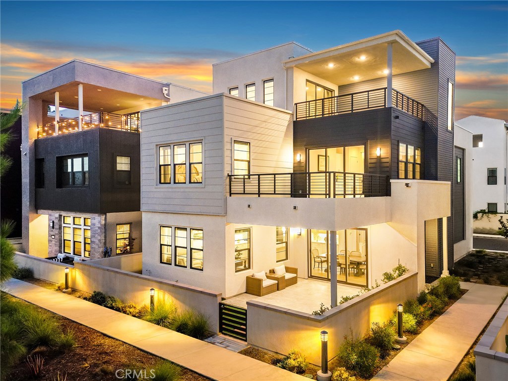 Modern home for rent! Discover the epitome of luxury living in this magnificent three-story house, nestled in the heart of Irvine's most prestigious new community, Solis Park. This stunning residence boasts a harmonious blend of modern elegance and functional design, offering a serene and sophisticated lifestyle. Upon arrival, you'll be greeted by an expansive front yard, perfect for outdoor entertaining or simply enjoying the beautiful Southern California weather. The grand sliding doors seamlessly connect the lush front yard to the inviting open-plan living area on the first floor. Here, the spacious living room, gourmet kitchen, and elegant dining area create an ideal setting for both everyday living and hosting gatherings. Ascend to the second floor, where a versatile loft awaits, providing ample space for a home office, family room, or entertainment area. Step out onto the oversized balcony to take in the fresh air and stunning views. This floor also features three generously sized bedrooms, each designed with comfort and style in mind, ensuring restful nights and rejuvenating mornings. The third floor offers a private sanctuary with an additional loft that has been thoughtfully transformed into an independent suite. Complete with its own large balcony, this suite provides a perfect retreat for guests or an exclusive escape for homeowners. This home's prime location is truly unparalleled. Just steps away from lush green parks and a mere one-minute walk to the community pool and park, residents can immerse themselves in the natural beauty and vibrant community atmosphere. The convenience of walking to the newest Solis Park Elementary School and Portola High School ensures top-tier education is within easy reach. Residents of Solis Park also enjoy access to the exceptional amenities of the Great Park community, including eight pools and numerous clubhouses. A short ten-minute drive brings you to the Woodbury Town Center, offering a variety of shopping and dining options. Additionally, the proximity to highways 133 and 5 makes commuting a breeze. Experience the finest in Irvine living with this extraordinary condo, where luxury, convenience, and community come together to create a truly exceptional home.
