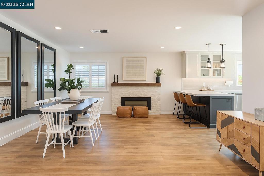 Turnkey perfection in the heart of San Ramon! This impeccably maintained 3-bedroom, 2-bath home offers modern updates, thoughtful upgrades, and timeless charm. The updated kitchen features high end stainless steel appliances, modern cabinetry, gas range, a deep sink and an eat-in peninsula. A modern electric fireplace flows into the dining room and continues into the family room for lots of usability. In addition, both bathrooms were stylishly remodeled in 2025. Luxury vinyl plank flooring extends throughout the main living areas, complemented by hardwood floors in the bedrooms. Major system upgrades include a newer AC, furnace, and tankless water heater, plus fresh attic insulation for year-round efficiency. Section 1 clearance has been completed, giving buyers peace of mind. Outside, enjoy brand new fences, raised garden beds, and a newly seeded front lawn. The northwest-facing orientation captures soft afternoon light helping the house feel light year-round. Just minutes from Pine Valley Middle School, this home blends convenience with comfort in one of San Ramon’s most desirable neighborhoods. With every detail addressed, this is a rare, move-in-ready opportunity you won’t want to miss!