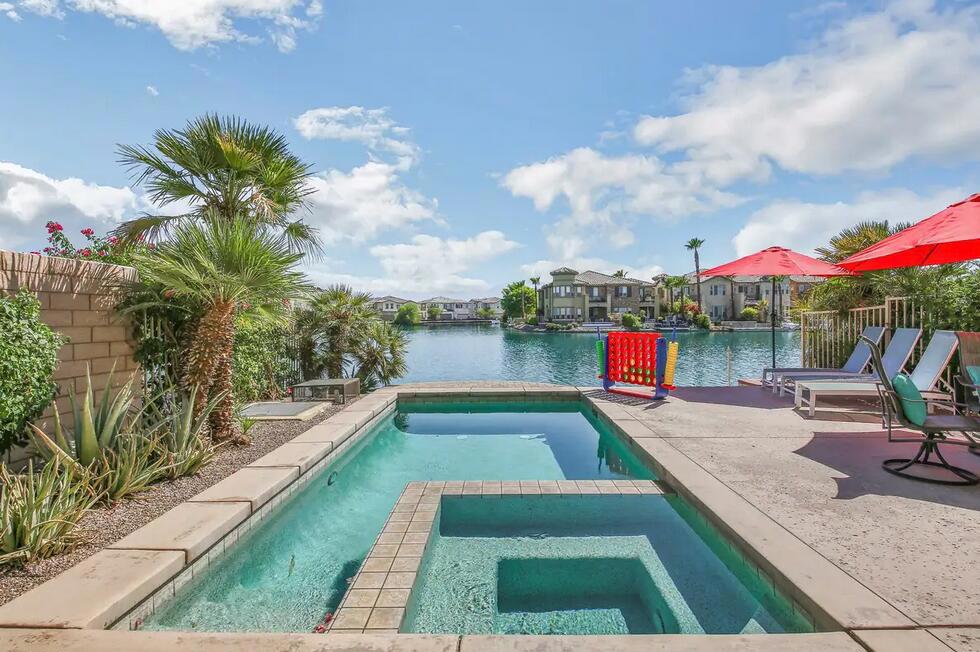 **PASSIVE INCOME** Short Term rental Friendly!Discover this stunning Terra Lago property, built in 2018 and located on a premium lot ON THE WATER with an amazing view. Terra Lago properties on the water are highly sought after and Airbnb guests will pay top dollar to stay here so they produce great passive income!This luxurious home features 3 bedrooms and top-tier upgrades. The airy great room blends the kitchen, living, and dining areas, highlighted by soaring custom wood ceilings and abundant natural light. The kitchen impresses with custom countertops, a sunken wet bar, a spacious island, and stainless steel appliances.Upstairs, the primary suite offers a covered patio with scenic lake and mountain views, a spa-style shower, and a modern soaking tub in the en suite bathroom. Two additional guest bedrooms, and a shared hall bathroom complete the upper level. Step outside to the entertainer's backyard, featuring an infinity-edge swimming pool and breathtaking vistas. Community amenities include a pool, gym, and 24-hour controlled access for peace of mind.