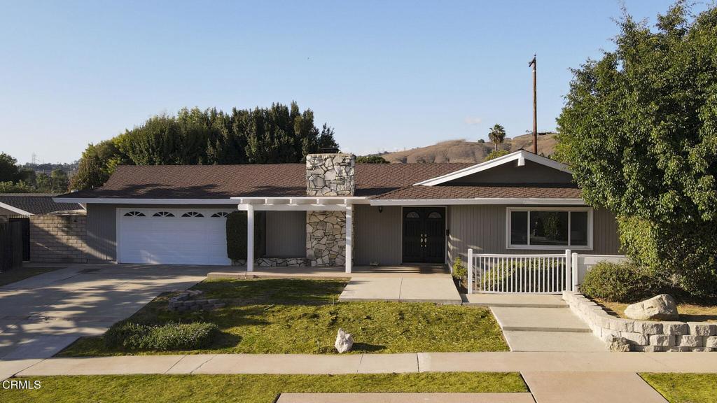 Welcome to this beautifully updated 4-bedroom, 3-bathroom home located on a quiet, well-maintained street in the desirable city of Brea. Designed for both comfort and function, this single-level residence combines mid-century charm with thoughtful modern upgrades throughout. The spacious living room features soaring vaulted ceilings, large dual-pane windows that fill the home with natural light, and a striking stone fireplace that serves as the centerpiece of the space. The adjacent dining area opens to the backyard, creating an effortless indoor-outdoor flow perfect for entertaining. The kitchen offers generous cabinet space, tile countertops, bar seating, and stainless steel appliances, ideal for family gatherings and casual dining. The private primary suite enjoys serene views and a light, airy feel, while the additional bedrooms provide ample space for guests. A dedicated office area offers the perfect setup for remote work or study. Step outside to your backyard retreat--complete with a sparkling pool, spacious patio, and mature landscaping that offers both privacy and tranquility. Whether lounging poolside on a sunny afternoon or hosting a weekend barbecue, this outdoor space is built for year-round enjoyment. Additional highlights include updated flooring, fresh interior paint, central air and heat, an attached two-car garage, and an inviting curb appeal enhanced by a stone-accented facade and manicured front lawn. Conveniently located near award-winning Brea schools, shopping, dining, and freeway access, this home offers the perfect blend of lifestyle, location, and livability.