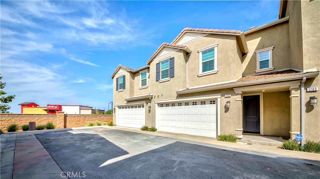 Beautiful two-story La Cresta home offers an ultimate combination of elegance, comfort, and scenic beauty. Situated in one of Upland’s most desirable areas, this retreat boasts stunning views and exceptional upgrades (worth approximately $90,000)!! Designed to impress, the residence features an expansive open-concept living space, bathed in abundant natural light and adorned with custom hardwood flooring, designer carpet, sophisticated window treatments, and refined tile finishes throughout. At the heart of the home, the chef-inspired kitchen is a masterpiece, showcasing custom white cabinetry, stunning quartz countertops, a stylish tile backsplash, and luxury handcrafted sinks. Equipped with premium stainless steel appliances and a spacious walk-in pantry, this culinary haven is designed for both beauty and functionality. Upstairs, the lavish primary suite serves as a private sanctuary, a walk-in closet, and a spa-like ensuite bath. The convenient upstairs laundry room comes fully equipped with a washer and dryer, while the home’s paid-off solar system (valued at approx. $21K). Additional luxury touches include an epoxy-coated garage floor for a sleek, polished finish. Residents of this exclusive community enjoy access to resort-style amenities, including a sparkling swimming pool, jacuzzi, scenic parks, and serene walking paths with built-in exercise stations. Ideally situated next to the Sycamore Hills Shopping Center, this prime location offers effortless access to fine dining, shopping, 210 freeways, ensuring seamless connectivity to surrounding areas.