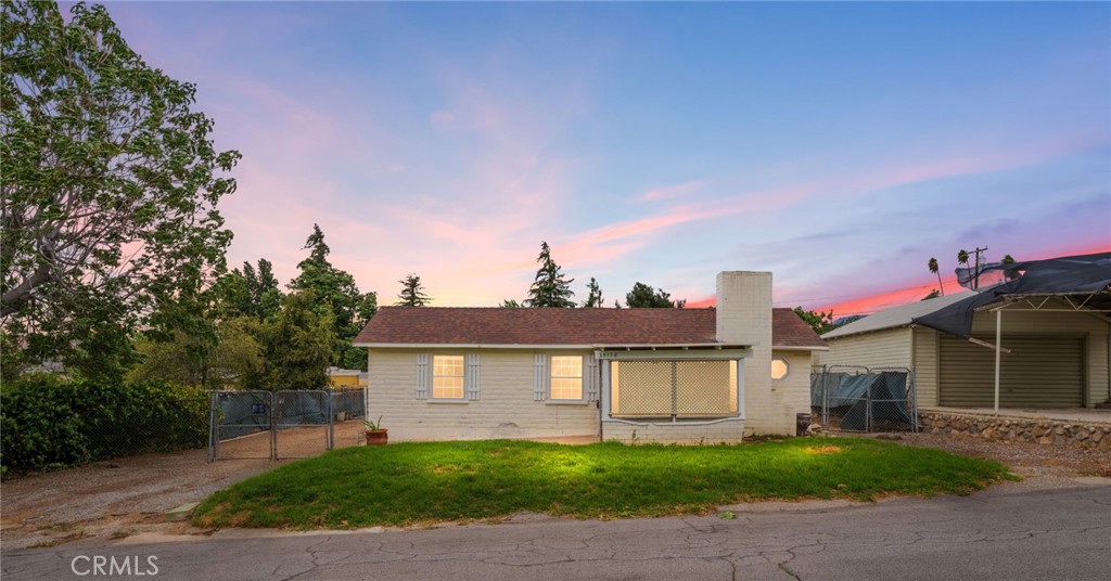 Single story home with a detached garage on a .25 acre flat lot with alley access! Located less than .5 miles from Uptown Yucaipa classics like White Rabbit Coffee and Brewcaipa, this home is an excellent example of classic Yucaipa charm in a great location. Enter through the front screened porch into the living room, where you'll find plenty of natural light and vaulted ceilings with exposed beams. A sizable bedroom has direct access to the full bathroom. The large kitchen features eat in dining. A smaller bedroom off to the side would also make a great home office. Heading out back, you'll find access to a sizable cellar - perfect for long term storage. There is a detached one car garage as well. The sizable, flat lot has great alley access. Great potential to build a large garage or shop, or even an ADU with it's own access! The home has new carpets throughout and fresh interior paint.