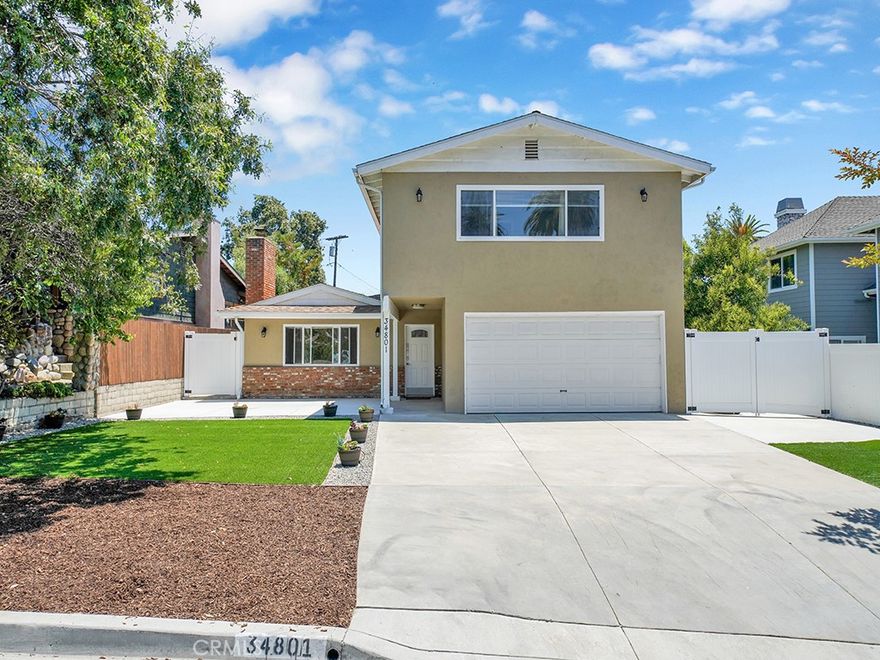 Located on the ocean side of the 5 freeway within the highly desirable Palisades area of Capistrano Beach is a move in ready home. The 4 bedroom (2 bedrooms up & 2 bedrooms down), 3 bath, 2,198 square foot home is only 2 blocks from Pines Park, a short .6 miles to the beach and positioned on a quiet street. Situated on a 6,670 square foot lot the spacious front lawn, rear and side yard areas provide ample room for entertaining your loved ones and guests. An attached 2 car garage, oversized driveway and additional gated parking with room to store your recreation vehicle is an added bonus. The main level features a downstairs primary bedroom with ensuite bath, an additional bedroom, living room with a cozy fireplace as well as an open concept great room that connects the kitchen, family room and dining areas. Sliding glass doors connect the great room to the back and side yards to create an easy transition between indoor and outdoor living. Upstairs there are two additional bedrooms and bathroom. This well maintained home has a newer roof, LED lighting throughout its interior, newer exterior lighting fixtures, ceiling fans, kitchen skylight and a newer 5 burner stove with convection oven. Additional amenities include an above ground spa in the backyard, rooms that are wired for internet/cable, baseboards, dual paned windows, newer flooring throughout, a wifi thermostat with AC both upstairs and downstairs. The home's turn key condition, convenient location to Doheny Beach, Dana Point Harbor, Salt Creek, Strands, San Clemente and shopping is hard to find.