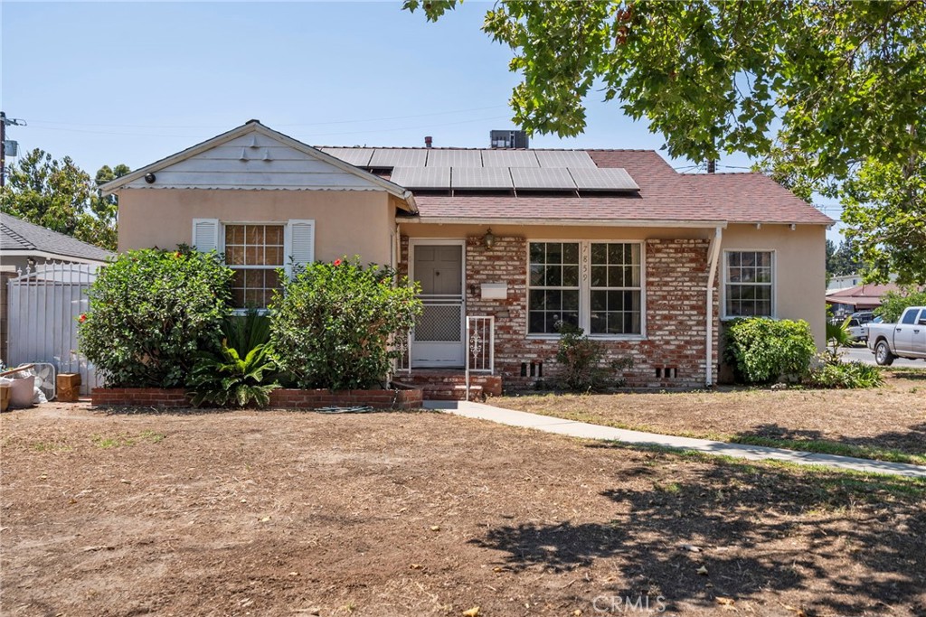 Incredible income-producing property tucked away on a quiet cul-de-sac in Sun Valley! With a total of 2,101 sq ft of living space on a 6,756 sq ft lot, this versatile home features 5 bedrooms and 2.5 bathrooms across two separate units. The front home offers 3 spacious bedrooms and 1 full bath, while the detached, permitted ADU includes 2 bedrooms, 1.5 baths, its own kitchen, and a comfortable living area, perfect for rental income or extended family living. Enjoy year-round comfort with central AC, energy savings from solar panels, and convenience with a detached garage, ample parking, and RV access. Ideally located near local schools, parks, shopping, and freeways—this one checks all the boxes!