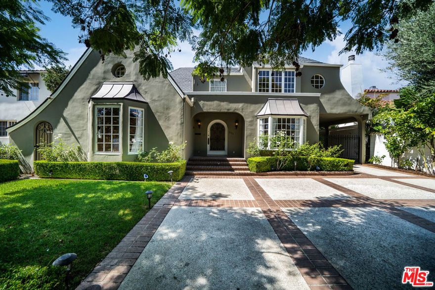 This character-filled home, located on one of the best streets in South Beverly Hills, combines classic style with comfortable living. The front entry opens to a bright living room with vaulted ceilings and a fireplace. A formal dining room with French doors leads to the backyard, creating an easy flow for gatherings. The kitchen features granite countertops, stainless steel appliances, and plenty of storage, and connects to a casual family room. Upstairs, the primary suite offers vaulted ceilings, a sitting area, and access to a private balcony. Additional bedrooms provide space for family, guests, or a home office. The backyard includes a brick patio with fountain, landscaped greenery, and multiple seating areas. With thoughtful details and a functional layout, this home offers close proximity to world-class shopping, amazing restaurants, and places of worship. Next showing window will take place on Thursday October 9th 4-6pm. Please contact Andrew Grad LA3 for an appointment