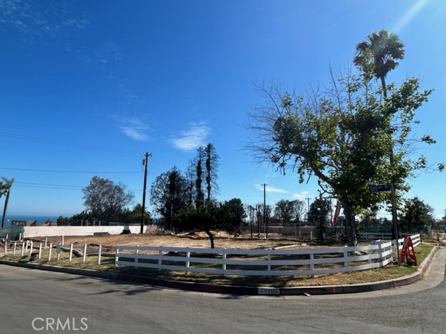 Rare flat corner lot in the Famous Marquez Knolls neighborhood with its well known elementary and amazing location! Home was destroyed in the fire. Phase 1 AND Phase 2 have been completed. Close to the beach, Palisades Village and much more. Sunset Blvd and PCH are just moments away. There is an ocean view when standing in part of the backyard. Don't miss this opportunity to be part of the re-build and have a custom home in one of LA's most sought-after communities. As is. Buyer to verify all information.