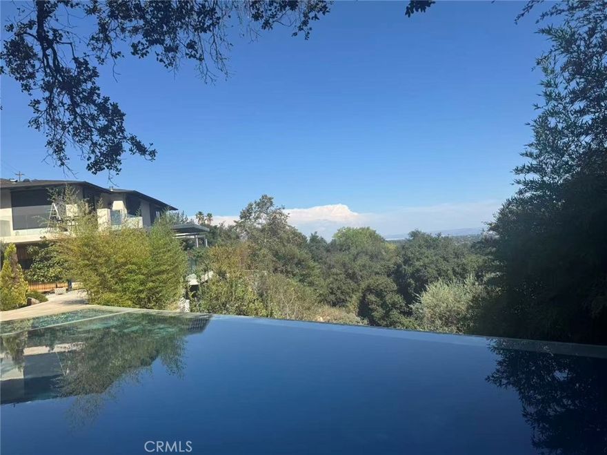 Welcome to  this beautiful house . An architecturally significant estate that embodies tranquility, sophistication, and world-class entertaining. Nestled within the prestigious North Arroyo enclave, this gated and secluded retreat rests on over an acre at the end of a private cul-de-sac, offering sweeping city views and an extraordinary harmony between indoor and outdoor living.

A private road leads beyond the gates to this hidden sanctuary. The meticulously curated landscape showcases a breathtaking infinity pool overlooking the city, a serene Koi pond beneath the front patio, and multiple covered terraces positioned to capture the beauty of every sunrise and sunset. A separate guest house provides elegant accommodations, complete with its own panoramic views and amenities.

For the automotive enthusiast, this is a car collector’s dream, featuring a six-car garage plus carport. 

The owner’s passion for Japanese garden design and elevated entertaining shines throughout. Eight distinct outdoor patios are crafted for every culinary occasion — including a custom shabu-shabu granite island with cascading waterfalls, pizza oven, roast duck oven, teppanyaki and sake island with stunning city views, a Western-style BBQ zone, and a tea patio beside a spring-fed creek.

Crowning the hilltop is a state-of-the-art, floor-to-ceiling glass gym, paired with a half basketball court below. After your workout, unwind in the main house’s steam room and Swedish sauna, complemented by smart-controlled LED lighting that enhances the ambiance throughout the property.

Inside, the residence is bathed in natural light, with an open layout that flows seamlessly through spacious living and dining areas, perfect for gatherings both grand and intimate. The gourmet kitchen is appointed with high-end appliances and beautifully restored cabinetry, inspiring culinary artistry. Upstairs, bedroom suites feature en-suite bathrooms and private balconies that capture breathtaking panoramic vistas. Authentic Asian art and architectural details add timeless elegance and cultural richness to every corner.

Located just minutes from Pasadena’s vibrant dining, shopping, and cultural destinations, this extraordinary estate offers a once-in-a-lifetime opportunity to experience refined Japanese-inspired living in the heart of California.