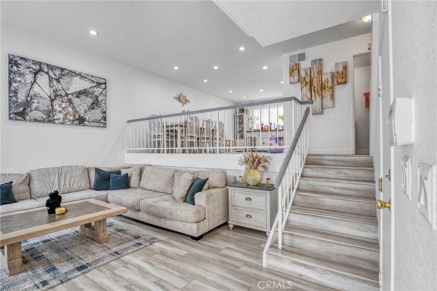 Welcome to this stunning tri-level townhome in the coveted Northbrook community, offering 2 bedrooms, 2.5 bathrooms. The living room impresses with floor-to-ceiling windows, recessed lighting, and laminate flooring, all overlooking lush greenbelt views. A private patio. The beautifully remodeled kitchen boasts Quartz countertops, stainless steel appliances, ample cabinetry, and an upgraded wet bar. The formal dining area provides plenty of seating, with a nearby powder room for guests. Upstairs, the spacious primary suite features a walk-in closet, recessed lighting. The second bedroom includes its own private bath. The attached two-car garage offers direct access, storage cabinets, laundry hookups, The HOA includes water and sewer, earthquake insurance, 24-hr security. This unit includes a spacious two-car garage with direct access to the home. Residents have access to a large swimming pool, tennis court, and peaceful water streams running throughout the area.