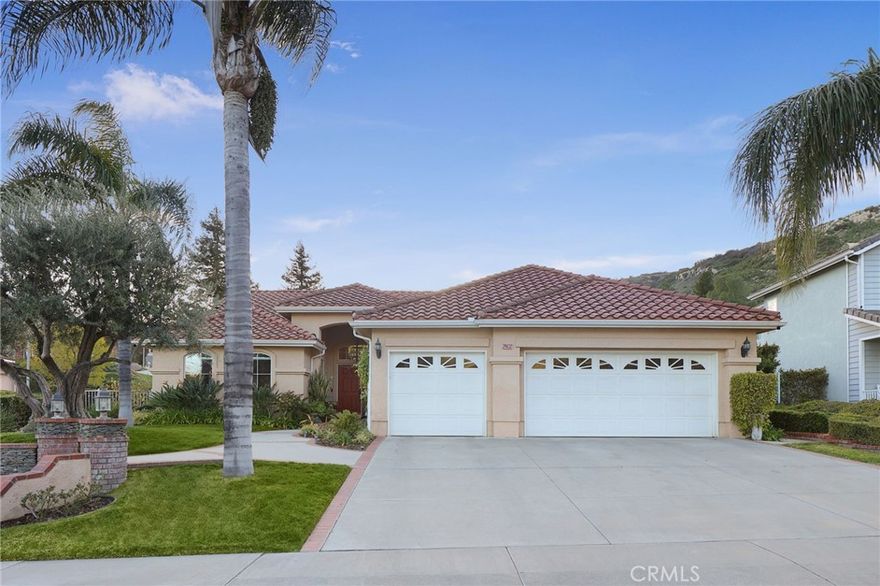 PRICE ADJUSTMENT!!Exquisite  redone single story home, ideally situated on a corner lot in the highly sought after "Stonegate Community" of West Hills. Resort style living. Enter through the double doors into a spaious living room with vaulted ceilings. Expansive windows and doors that through which the rooms are flooded with natural light. The chef's kitchen is the heart of the home, complete with a large center island, granite countertops, and newer stainless steel appliances. It seamlessly flows into the inviting family room where a cozy fireplace and wine refrigerator sets the perfect ambiance. The true primary suite is a peaceful retreat with lofted ceilings, a generous walk-in closet, and a spa-like en-suite bathroom featuring dual vanities, a soaking tub, separate shower-all overlooking the beautifully landscaped gardens. Thoughtfully upgraded and meticulously maintained, the home also offers three additional bedrooms and two full bathrooms, ideal for family or guests.  Step outside to your own private oasis, lushly landscaped grounds, two expansive covered patios with skylights and a ceiling fan, a built-in BBQ, and a stunning pebble tec pool and spa with cascading waterfalls.  Enjoy serene views of the surrounding hill and an abundance of fruit trees, creating the perfect setting for both relaxation and entertaining. Located within the prestigious school district for Pomelo,, Hale, and El Camino School, and just minutes from Warner Center, Westfield Topanga, The Village, Calabasas Commons, top-tier shopping, parks, and scenic hiking trails-this home truly has it all!