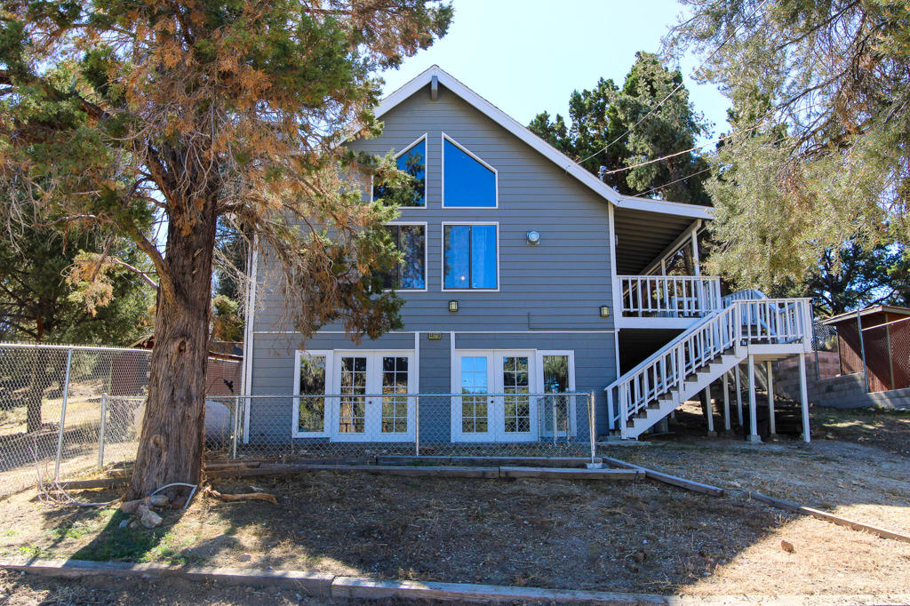 A Must See... Located in Baldwin Lake, this property features a beautiful wood interior with vaulted open beam ceilings. The exterior was painted and the decks re-stained one year ago. In 2024, the septic and water tanks were replaced. The yard is fully fenced, and the bottom story could be converted into a separate living area. Enjoy huge, covered decks. Attractive owner financing may be available, with potential for 10% down and interest-only payments for 7 years.