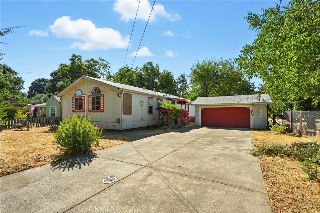 Step inside this adorably updated 3-bedroom, 2-bath manufactured home with a two-car garage located right in the heart of town, featuring brand-new flooring throughout. The large living room flows seamlessly into an open-concept kitchen and dining area, creating a perfect space for gatherings and everyday living. Enjoy year-round comfort with the updated mini-split unit providing precise temperature control. The oversized master bedroom offers an elegant master bath with two sinks and a generous walk-in closet, ideal for all your storage needs. Combining modern updates with cozy charm, this home provides both convenience and comfort.