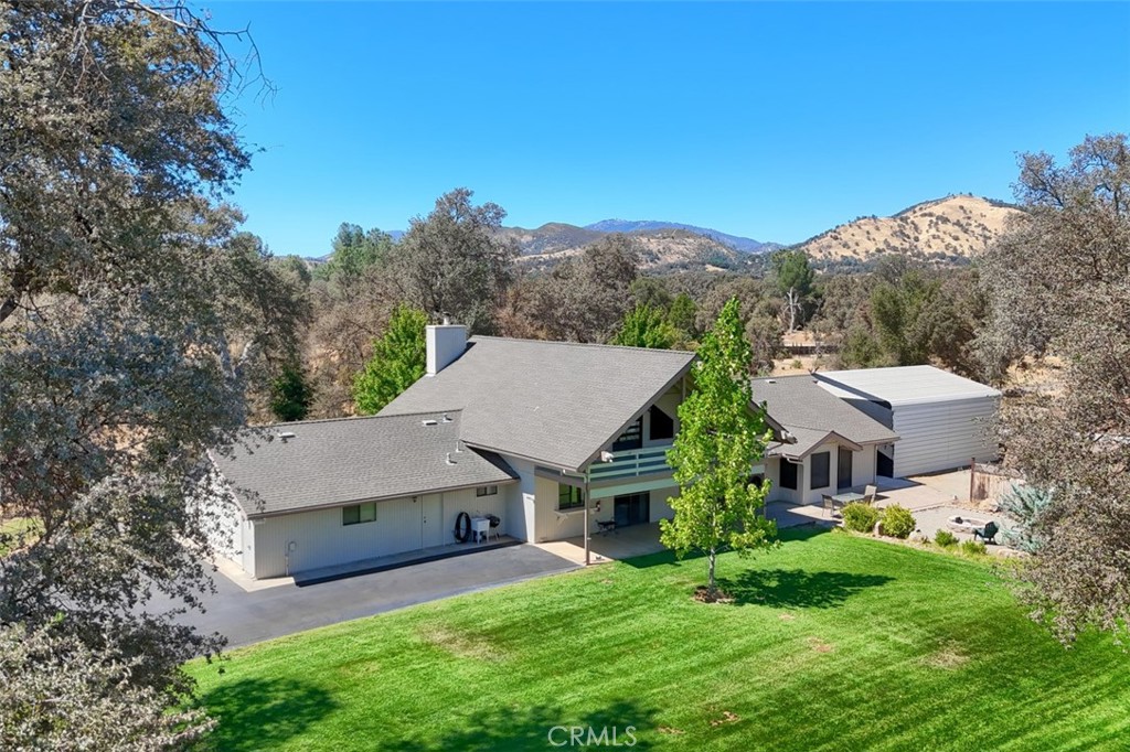 Welcome to this impressive custom-built home that sits on 7.29 acres and features 4 spacious bedrooms, 3 full baths, and a versatile loft area perfect for a home office, playroom, or guest retreat. From the moment you arrive, you'll be captivated by the tree-shaded front yard, thoughtfully set back from the highway to offer privacy and tranquility. Whether you're entertaining guests or enjoying quiet evenings at home, this property delivers comfort and charm in every corner.
From the moment you step through the level entry, you're greeted by soaring cathedral open-beam ceilings in the living room, complete with a ceiling fan and expansive windows that frame sweeping views of the surrounding hills. Solar screens and motorized shades provide comfort and convenience while preserving the spectacular scenery.
The open floor plan flows effortlessly, ideal for both everyday living and entertaining. The loft opens onto a covered deck, your private perch to soak in panoramic vistas or unwind with a morning coffee. The kitchen features a large walk-in pantry, ample counter and cabinet space. There is a generous laundry room which includes the washer and dryer, linen storage and a built-in ironing board for added practicality.
This home features a 5 TON HVAC system and specially designed ventilation system with a timer that forces hot air outside, an insulated whole house fan on timer, R76 attic insulation. Covered parking area measures 30'x30'x12' with lighting for all your equipment or RV parking and another 20'x24' paved covered parking, 2 sheds (10'x16') and (12'x20') Tuff Shed with loft. A LifeSource whole house water system has recently been added which uses no Salt and has no need of regular servicing. This spacious parcel is ready for your livestock or used as an open country setting.
