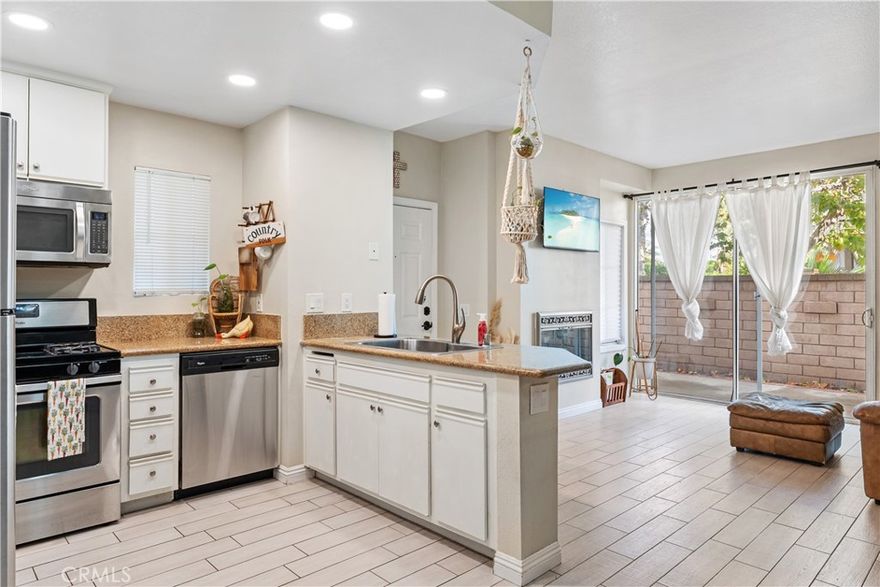 Rare single-story end-unit in Portola Hills with direct garage access, generous storage, and EV charging potential. This private lower-level home lives like a retreat, featuring an expansive patio and bright open living space with recessed lighting, a cozy fireplace, and neutral finishes throughout.
The spacious primary suite includes a dual vanity and walk-in shower, while the second bedroom and full bath offer versatility for guests or a home office. Enjoy in-unit laundry and a private one-car garage with built-in storage and nearby guest parking.
Resort-style amenities include a pool, spa, and greenbelts with direct access to scenic canyon trails. All within the top-rated Saddleback Valley Unified School District and minutes from shops, dining, and recreation.
This highly desirable home offers privacy, practicality, and features rarely found at this price point, an exceptional opportunity you won’t want to miss.