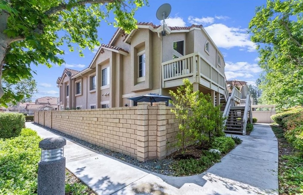 Wait, a condo with DIRECT GARAGE ACCESS that's oversized and EV-ready with room for storage? This condo understood the assignment! This charming lower-level unit sits at the end of the building and is ideal for those seeking a quieter and more peaceful living environment. The layout provides a sense of separation rarely found in attached homes and offers a very large outside patio and living space, this home lives like a private retreat.
Step inside to an inviting open-concept living space, where natural light highlights recessed lighting, a gas fireplace, and neutral finishes that create a warm, airy atmosphere. The kitchen is thoughtfully updated with granite countertops, stainless steel appliances, and a gas range—a perfect setup for both everyday meals and special gatherings. Whether cooking for one or many, the space flows beautifully into the living room for seamless everyday living. Both bedrooms are located on the same level for ease and accessibility. The primary suite offers a calm and cozy escape, complete with a private en-suite bathroom featuring a dual vanity and walk-in shower. The second bedroom is perfect for guests, a home office, or a creative studio and is served by a full bathroom with a tub-shower combo. Just off the kitchen and living area, a sliding glass door opens to your own private patio, ideal for grilling, entertaining, or enjoying peaceful moments with a coffee in hand. For added convenience, the home features in-unit laundry, central heat and A/C, and a direct-access one-car garage with built-in storage and nearby guest parking—offering practicality without sacrificing comfort. Living in Portola Hills means enjoying resort-style amenities like a pool, spa, greenbelts, and direct access to miles of hiking and biking trails that weave through the surrounding canyons and nature preserves. All of this within the highly acclaimed Saddleback Valley Unified School District and just minutes to shopping, dining, and major commuter routes. Don’t miss this opportunity to live in one of Lake Forest's most peaceful and picturesque communities.