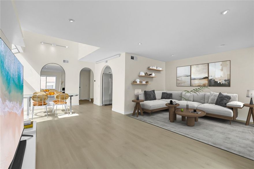 Welcome to your Elegant and Luxurious END-Unit Townhome in the heart of South Covina. Experience the perfect blend of modern design and everyday comfort in this Beautifully Remodeled residence, ideally situated within the quiet, Gated community of Andalucía. Boasting over $100,000 in upgrades and renovations, this exquisite residence has been transformed into a Personal haven that feels like a true Model home. Step inside and walk through the sophisticated foyer, where a graceful Arched hallway leads you into a bright and airy open-concept living space. Soaring High Ceiling, expansive windows, and an abundance of Natural Light create a warm, inviting ambiance that exudes style and elegance. The Main Level features a versatile Office / Den, currently used as a 3rd Bedroom, along with a convenient stylish Half Bath. The chef-inspired Kitchen is a true centerpiece, equipped with stainless steel appliances, stunning white quartz countertops, and custom cabinetry, perfect for both everyday cooking and entertaining. Enjoy meals in the elegant dining area, beautifully framed by oversized bay windows and skylights, then relax in the spacious living room designed for family gatherings. Ascend the beautifully crafted staircase to discover a luxurious Primary suite complete with a Spa-like bathroom featuring a Soaking tub Shower, floating modern double vanity, and a generous Walk-in Closet. The Secondary Bedroom offers its own private balcony, ensuring comfort and privacy for everyone. Smart home touches and designer light fixtures enhance the home’s modern charm. Step outside to your private patio, perfect for BBQs, morning coffee, or intimate gatherings. Additional highlights include direct access downstairs to a Two-car garage and a dedicated laundry area with abundant storage. Residents of Andalucía enjoy access to exclusive community amenities including a resort-style swimming Pool and Hot Tub, Clubhouse, and lushly landscaped grounds. Conveniently located near shopping centers, restaurants, parks, and major freeways, this home offers both luxury and lifestyle in one exceptional package. Come experience this stunning South Covina gem! Your new home awaits!