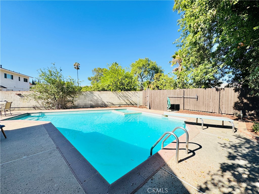 Beautiful home in a charming neighborhood in North Hills is available FOR LEASE! This spacious 5 bedroom, 3 bath pool home is situated on a quiet and lovely cul de sac. This home is colorful with a large living/dining room combination, central AC/heat, ceiling fans, ample parking, and Solar Panels. Sizable bedrooms, with three on the first floor and two bedrooms upstairs. Large Kitchen offers tons of cabinet space and counters with a stainless-steel refrigerator, stove/range, and dishwasher. The downstairs largest bedroom/bonus room does feature an en-suite bathroom with easy access to the backyard. The dining area and living room have an open concept with newly refinished wood floors. The fully fenced pool with patio are an amazing added feature perfect for entertaining, hosting get-togethers, and BBQ's. Utilities are not included, but gardener and pool maintenance are included. Solar is paid off so there is no lease payment. Solar is used for the pool and spa. Lot will occassionally be shared, owner may occupy the back ADU if in state. Otherwise, it will not be occupied. Parking includes 2 spaces under a carport plus tons of street parking. Property is located near restaurants, shopping, and public transportation. Call or text to schedule a viewing today!