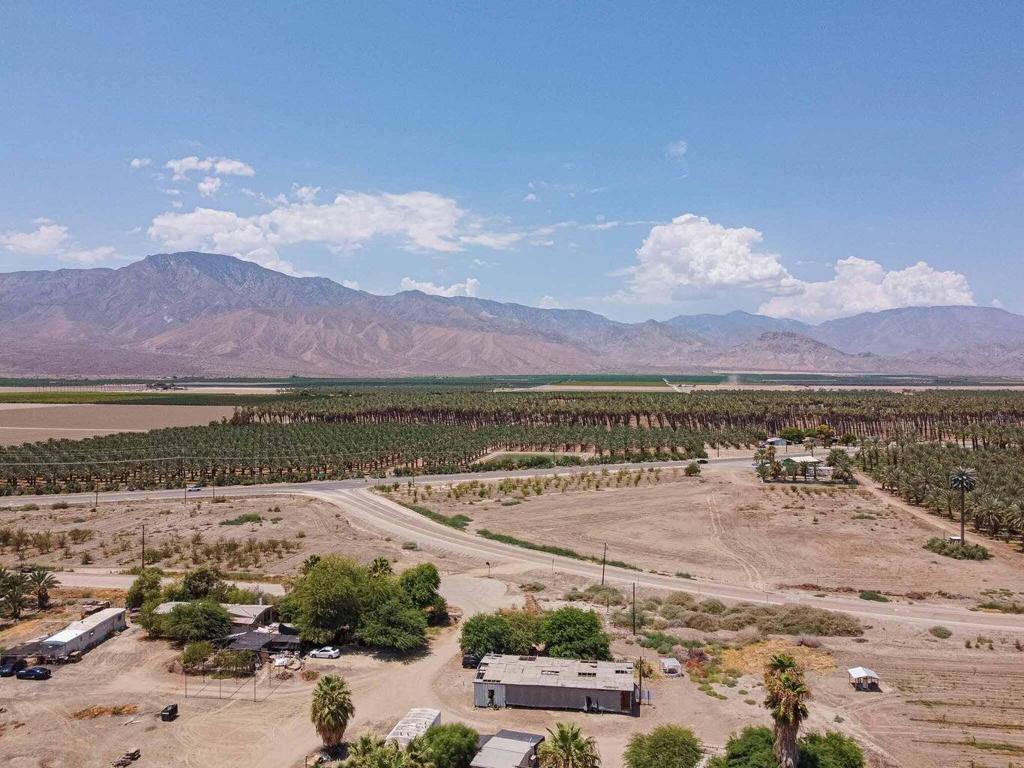 19.55 acres available for light agriculture Single wide mobile home on site permited.Newer IID electric panel and water well has been updated with cement slab and shade. Zone to install manufactured homes for passive income. W-2 Zone
