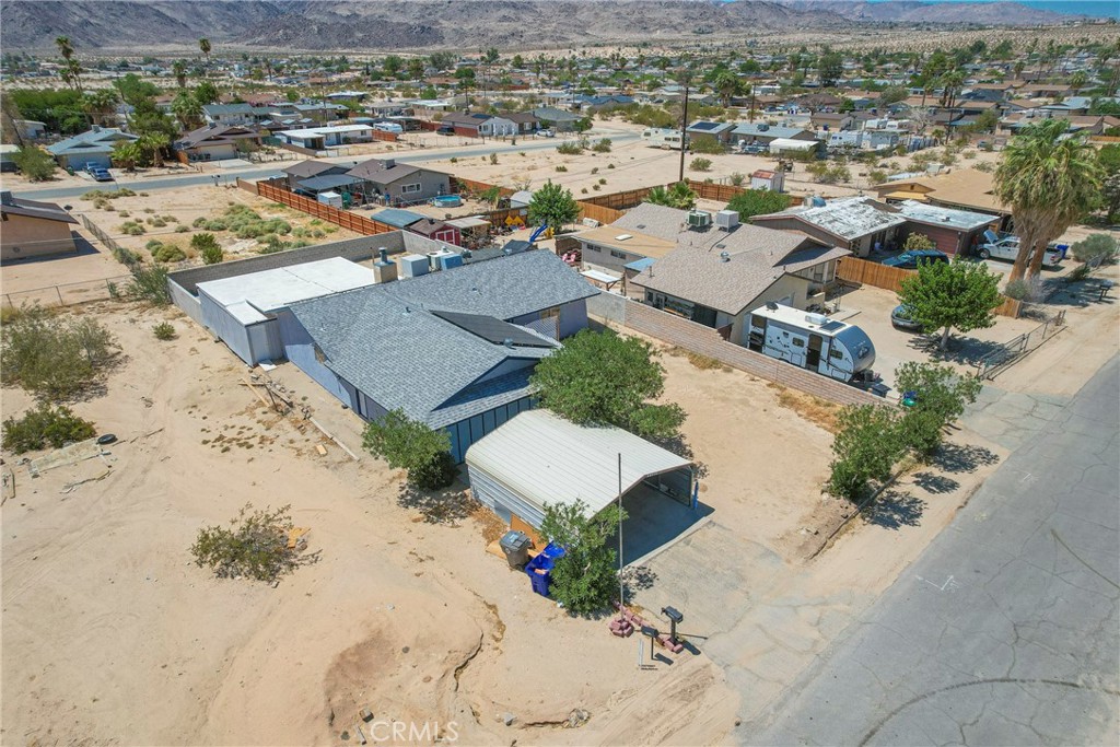 Welcome to Sunnyvale! Your desert retreat in the heart of Twentynine Palms! This charming single-story home offers 3 spacious bedrooms, 2 bathrooms, plus a versatile bonus area perfect for a home office, hobby space, or guest lounge. Spanning 1,254 sq. ft., this residence blends comfort and functionality with a warm fireplace for cozy evenings, central heating and air for year-round comfort, a water softener, and an inviting layout designed for easy living.
The bright, open living space flows seamlessly into a well-appointed kitchen and dining area, ideal for gatherings with friends and family. A convenient attached 2-car garage, a carport in front, and additional driveway space provide plenty of parking. E
Set on an 8,680 sq. ft. lot, the backyard is a blank canvas for your outdoor vision—already featuring a storage shed for tools, gear, or creative projects. Enjoy evenings under the desert stars, host weekend BBQs, or cultivate your own garden oasis.
Built in 1984 and lovingly maintained, this home is just minutes from local shops, schools, dining, and the iconic Joshua Tree National Park—making it an ideal primary residence, vacation getaway, or investment property. Experience the beauty, peace, and adventure of desert living—your Twentynine Palms lifestyle starts here!