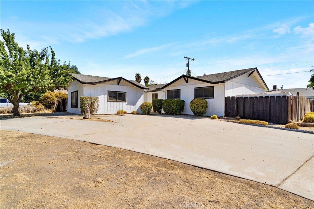 Welcome to your dream home! This stunning 4-bedroom, 3-bathroom gem sits on a large corner lot and boasts 1,812 sqft of stylish living space. Freshly painted throughout, this home features an updated kitchen with beautiful grey cabinets, striking gold handles, and a chic backsplash. The open living area showcases a gorgeous fireplace, creating a cozy atmosphere. With plenty of storage throughout, you'll have space for everything! Step outside to your own private oasis with a sparkling pool, perfect for summer gatherings. Don't miss this beautifully upgraded home!