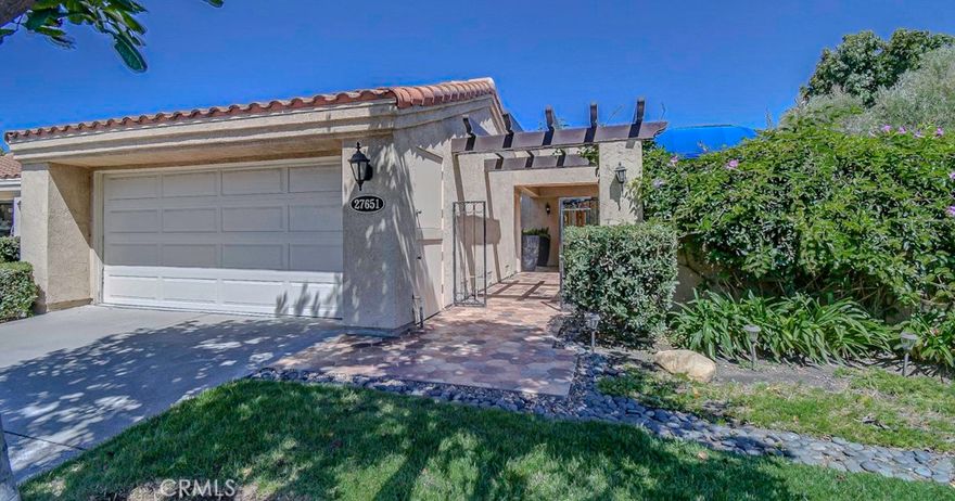 Spacious, single level garden home in the desirable community of Mesa Verde in San Juan Capistrano. You'll enjoy indoor and outdoor living in this 2 bedroom, plus an office/den, 2 bath detached home. It is one of only four detached condominiums in the Mesa Verde community. Square footage is 1,674 per tax assessor, and 1,728 sq. ft. per builder floor plan. Features include a private courtyard entry, multiple patios, and an open floor plan with vaulted ceilings and crown molding. The light and airy living room features a fireplace and a sliding door that leads onto a large patio tiled with pavers, and has a ceiling fan and a firepit. An Alumawood patio cover provides shelter from the sun or rain and is an ideal year-round space for relaxing, entertaining, and dining al fresco. The dining room offers a built-in buffet and overlooks a greenbelt. The kitchen features a garden window, abundant cabinets, granite counters, and a breakfast nook that opens onto a private courtyard patio for enjoying your morning coffee or tea. The spacious primary suite has a vaulted ceiling, a soaking tub and a separate tiled shower, an upgraded vanity with two sinks, mirrored wardrobe closets, a ceiling fan, and a sliding door to the rear patio. Convenient indoor laundry closet with washer and dryer hook-ups and storage cabinets. The second bedroom opens to a separate patio. Located on a quiet cul-de-sac street with plenty of guest parking. 2-car garage with abundant storage cabinets. Mesa Verde has two community pools and spas, meandering walking paths, greenbelts and manicured landscaping. Ideal location near San Juan Hills Golf Course, Windmill Park, hiking, biking, and horse trails. Enjoy the San Juan Capistrano lifestyle with its fantastic restaurants, Mission San Juan Capistrano (known as Jewel of the Missions), the historic Los Rios District, and River Street Marketplace. Just minutes from Doheny State Beach and Dana Point Harbor. There are NO age restrictions in this community.