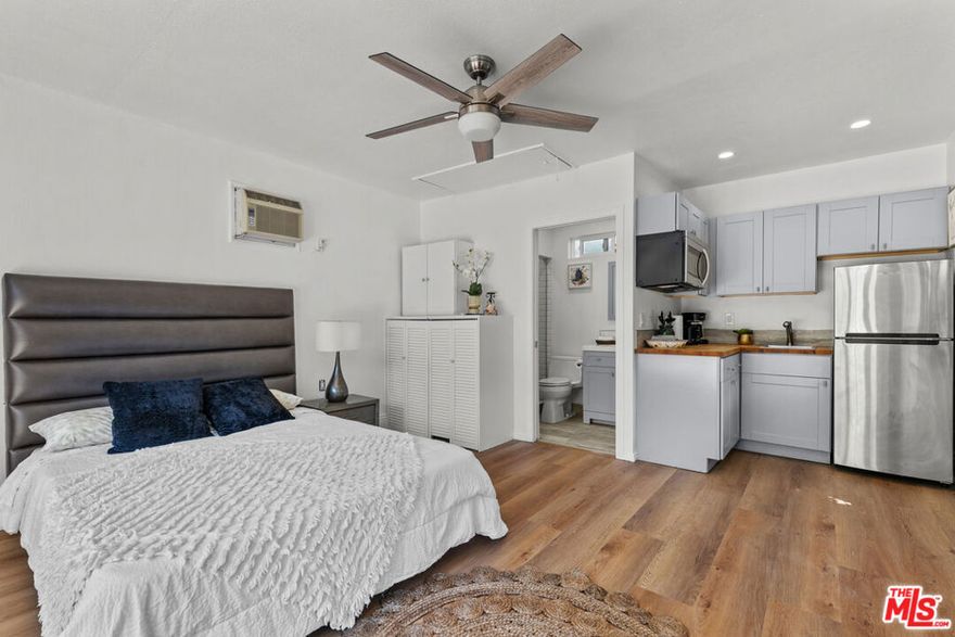 Bright and airy detached guest suite available for lease in a desirable Sherman Oaks neighborhood. Tucked behind the main residence, this thoughtfully updated and furnished studio offers an inviting, open layout with French doors. The interior features include a kitchen equipped with modern cabinetry, butcher block counters, refrigerator, microwave, and ample storage. The bathroom includes a walk-in shower. There is also a wall AC unit, ceiling fan, and ample natural light throughout. Plenty of street parking. Located just moments from Ventura Blvd, parks, shopping, dining, and easy freeway access.