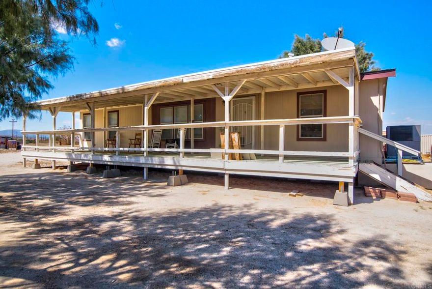 If you long for great fun in the desert this property is for you! Located in Borrego Springs only 4 mile from the airport right off Split Mountain Rd. This 3 Bedroom, 2 bath beautiful manufactured home built in 2007 has all that you need for year round living. As you approach the home you will notice that it sits on a large l100 x 300 rectangular shaped lot that is fully fenced. It has a well 125 deep with a bladder that hold 60 gallons. It has 2 1/2 horse pump with a pump house. 2 sea containers 10 x 40 have permits with the county. The 1,000 gallon septic tank is 2 years old. Living area is a large 1387 square foot home. It boasts 200 AMPS electrical system throughout, a 50 gal water heater, 5000 BTU AC unit and it is equipped with an automatic sprinkler system. Popular neutral beige flooring and walls make a perfect canvas for all your personal decorating ideas. Spacious kitchen has beveled glass cabinet doors, large pantry for your dry goods, extra outlets for all your portable appliances. Dishwasher, refrigerator plumbed for an ice maker will convey. Dining area will accommodate a table for six. Overhead fixture is an upgraded brushed nickel chandelier. The living room and master bedroom are pre-wired for ceiling fan. Master bedroom suite offers mirrored wardrobe doors and a huge bathroom with sunk-in bathtub, his and hers sinks and a semi private area for taking care of business. The other two bedrooms are located at the opposite end of the home and they share a full bathroom