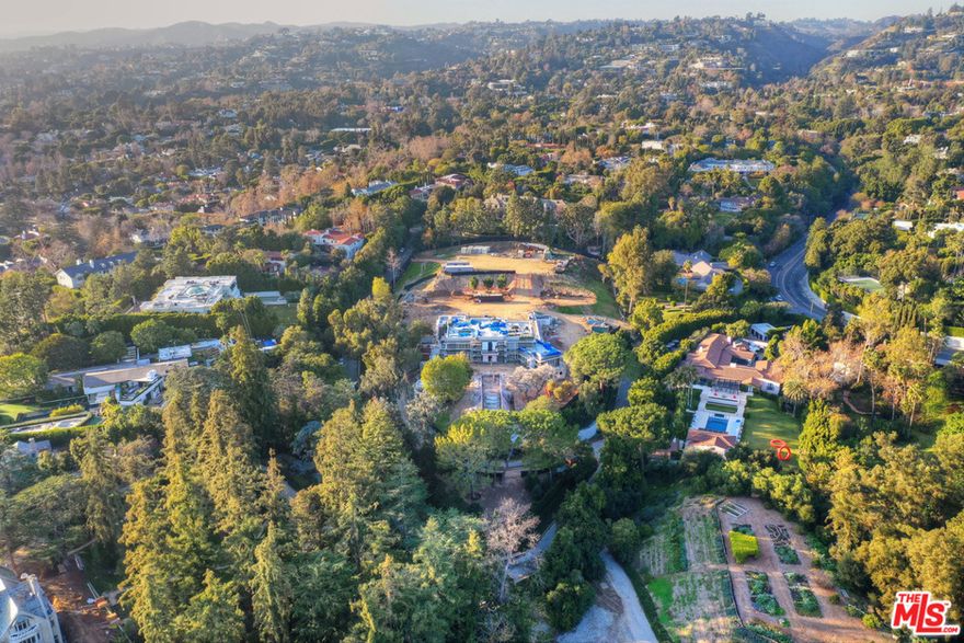 Extraordinary opportunity to build an architectural masterpiece in prime Holmby Hills. Plans and permits, over 2 years in the making, are issued to start construction immediately for this 28,950 ft² home by award-winning architect Woods + Dangaran. World-renowned designers have collaborated to create a curated experience that boasts impeccable design and restrained elegance. The park-like and expansive grounds of appx. 1.4 acres are designed by Christine London. The property hosts two structures, both of which offer understated style by Woods + Dangaran, and utilize three main materials -  architectural concrete, travertine, and teak. The main residence features 5 family bedrooms and 2 staff rooms, while the guest residence enjoys 2 bedrooms. The estate is complete with a large gym, yoga studio, treatment rooms, spa facilities, and a 200+ft lap pool. This offering is a rare chance to build a one-of-a-kind estate in one of the world's most desirable and globally recognized locations.