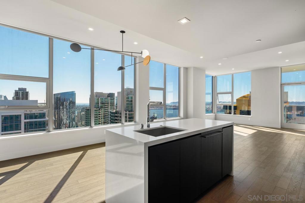 Welcome to Savina Penthouse 3604 — now available for lease, unfurnished. This stunning top-floor residence in one of Downtown San Diego’s most sought-after high-rises offers sweeping southwest views of the bay, ocean, Coronado, and city skyline. Designed for modern luxury, the home features premium finishes throughout, including hardwood floors, soaring ceilings, motorized shades, and a chef’s kitchen with Gaggenau and Thermador appliances plus a wine fridge. The flexible den is ideal for a home office or guest space. Enjoy the convenience of two parking spaces, and exclusive access to Savina’s world-class amenities—pool, fitness center, sauna, club room, and full-service concierge.