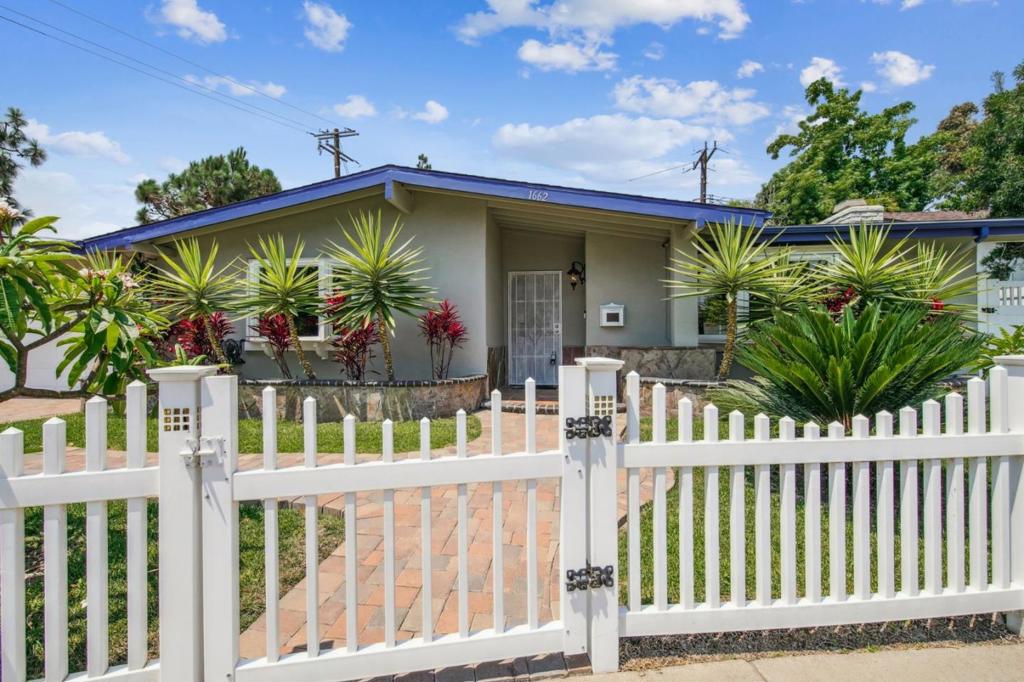 A private pool, a peaceful yard, and a location in one of Costa Mesas most loved neighborhoods - this 3-bedroom, 2-bath home offers a vibrant lifestyle both inside and out. Behind the white picket fence and manicured tropical garden, youll find a comfortable layout with classic California charm. The living area is light-filled and inviting, anchored by large windows that frame the front yard greenery, while the kitchen and dining space sit just beyond, designed for both everyday meals and weekend gatherings. Tile flooring keeps the space easy to maintain, while wide sliders draw you outside to the highlight of the home - your very own pool, as well as a generous patio and full privacy wall. Theres room to lounge, garden, dine, or simply take in the sun in peace. All three bedrooms are well-sized, and the two bathrooms are conveniently located to support both family life and hosting guests. A two-car attached garage adds storage and function, while the backyard remains fully fenced. You're just minutes from the shops and dining at South Coast Plaza, with local favorites like Mitsuwa Marketplace and The LAB around the corner. Access to the 405 and 55 freeways also keeps the rest of Orange County within easy reach.