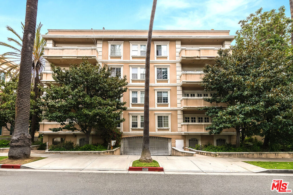This beautiful newly remodeled 1700+ sq ft, bright, front facing corner condominium unit is located in the heart of Beverly Hills! The elegant 2-bedroom, 2.5-bathroom residence offers the perfect blend of luxury, comfort and convenience. The large open-concept living and dining area features rich hardwood floors, a high ceiling, recessed lighting, a fireplace and a pair of French doors that lead to balconies. The fully remodeled kitchen is a chef's dream, equipped with brand new stainless steel appliances and custom cabinetry. The luxurious primary suite is a private retreat with a generous walk-in closet and spa-inspired bathroom featuring both a free standing tub and a separate walk-in shower. The laundry room has a full-size side-by-side washer and dryer. There are two side-by-side parking spaces for the unit in the gated entry garage. Just moments away from Rodeo Drive, fine restaurants, luxury brand shopping and renowned art and entertainment venues, the property is also close to world-class medical centers. Shown by appointment only.