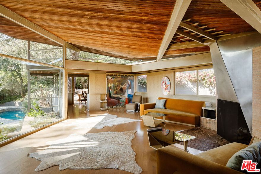 The Lechner House R.M. Schindler, 1949 Los Angeles Historic-Cultural Monument #1024 A true architectural treasure and a masterwork of Mid-Century Modern design, The Lechner House stands as one of Rudolph M. Schindler's most celebrated residential works. Hidden behind private gates, this 1949 estate unfolds across lush, park-like groundsa serene setting that feels both expansive and deeply private. Designated Los Angeles Historic-Cultural Monument #1024, the home reflects Schindler's genius use of organic materials, spatial rhythm, and seamless connection to the landscape. Inspired by Native American cave dwellings, walls of glass allow the interiors to open dramatically to the outdoors, framing wide, cinematic views of nature, flooding each room with natural light. After a meticulous, multi-year restoration by Pamela Shamshiri, Design Principal of Studio Shamshiri, the residence was thoughtfully revived to honor Schindler's original vision while introducing quiet, modern refinements for contemporary living. The current owners continued this legacy with a complete exterior restoration by famed architecture studio Escher GuneWardena, new landscaping by Terremoto Landscape, and the revival of the original pool creating an atmosphere that feels timeless, soulful, and alive.Spanning approximately 4,000 square feet over two-stories, the home offers four bedrooms and three-and-a-half baths on an oversized lot making it one of Schindler's more spacious residential works. Every detail encourages an elevated yet effortless way of life, defined by natural materials, open sightlines, and a deep sense of tranquility. Fully restored to its intended purpose, The Lechner House embodies pedigree, peace, and proportional living piece of Los Angeles architectural history. Every surface tells a story of craftsmanship and care; every view draws you back to nature. Home is on Mills Act.