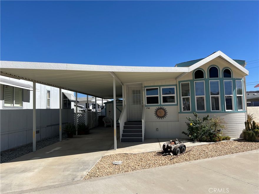 You own the land. This is a corner unit with more room, curb appeal, and privacy. The owner has done major upgrades to this beautiful unit. Brand new roof, new paint inside and out, and new air conditioning unit. It has a permitted extension that is not allowed to be done anymore on other units. This is a perfect home for a person over 55. It has an enclosed shed, new fence for an enclosed patio. This park offers a security entrance. It has a clubhouse, a library, an activity center, a craft area, ping pong tables, a horseshoe area, a beautiful heated pool, and a resort-style setting spa. There are pool tables, shuffleboards, a library, and a playroom, and this is for $292.00. The park sits within a mile of most stores and shopping centers. You are not going to regret looking at this. $292 association dues include trash, water, Spectrum cable TV, and Wi-Fi, which makes it a bargain.