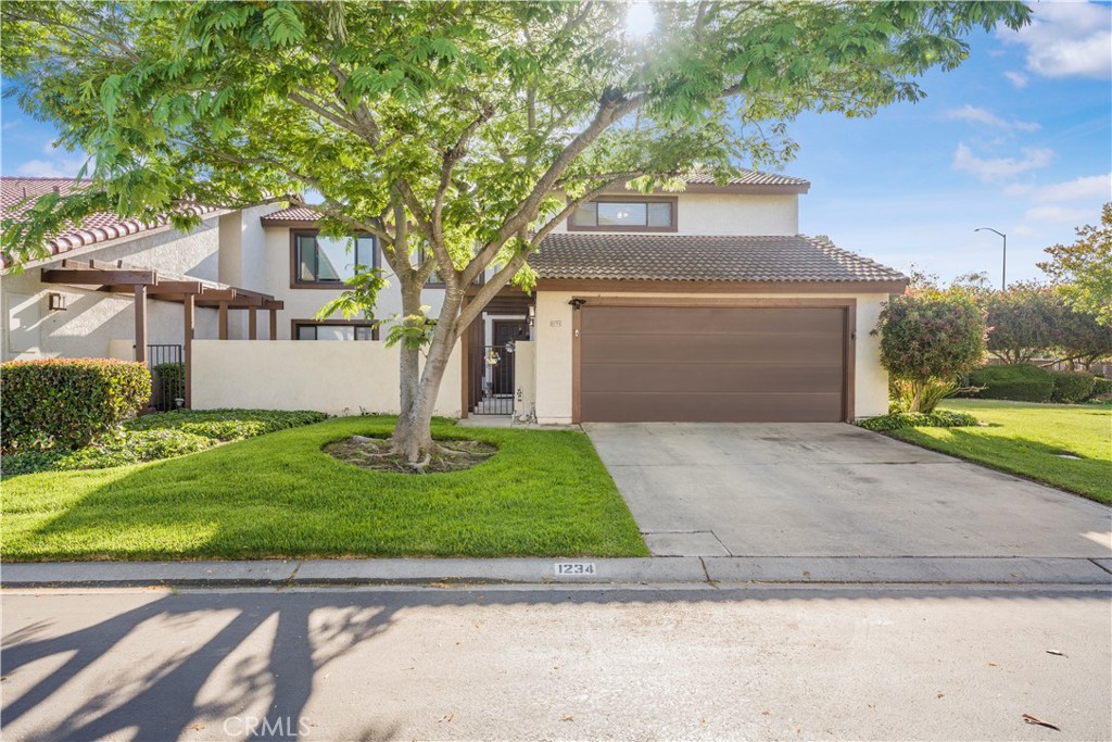 Welcome to this desirable 1,715sq ft end-unit townhome showcasing 3 bedrooms, 2.5 bathrooms, and an attached two-car garage. Thoughtfully designed, this residence features a spacious layout complemented by tasteful upgrades and finishes throughout.
Step inside to a warm and inviting family room, complete with a charming fireplace, creating an ideal setting for relaxation or entertaining. The kitchen and dining area blend seamlessly, highlighted by rich wood cabinetry and classic Spanish tile flooring, combining timeless style with modern practicality. A private courtyard just beyond extends the living space outdoors, offering a tranquil retreat.
Upstairs, the expansive primary suite boasts dual closets and a private en suite bathroom. The additional bedrooms provide generous storage with each boasting a walk-in closet, while the guest bathroom is thoughtfully designed with abundant storage as well.
Refined touches include updated contemporary lighting throughout, beautiful laminate flooring and plush carpeting upstairs that enhances the comfort of the private living spaces. Dedicated washer/dryer hookups in the garage add everyday convenience to this home.
With its sought-after end-unit location, flowing layout, and refined details, this property offers a harmonious blend of comfort, versatility, and timeless appeal—all within a beautiful community setting where you can enjoy the outdoors without maintaining it.